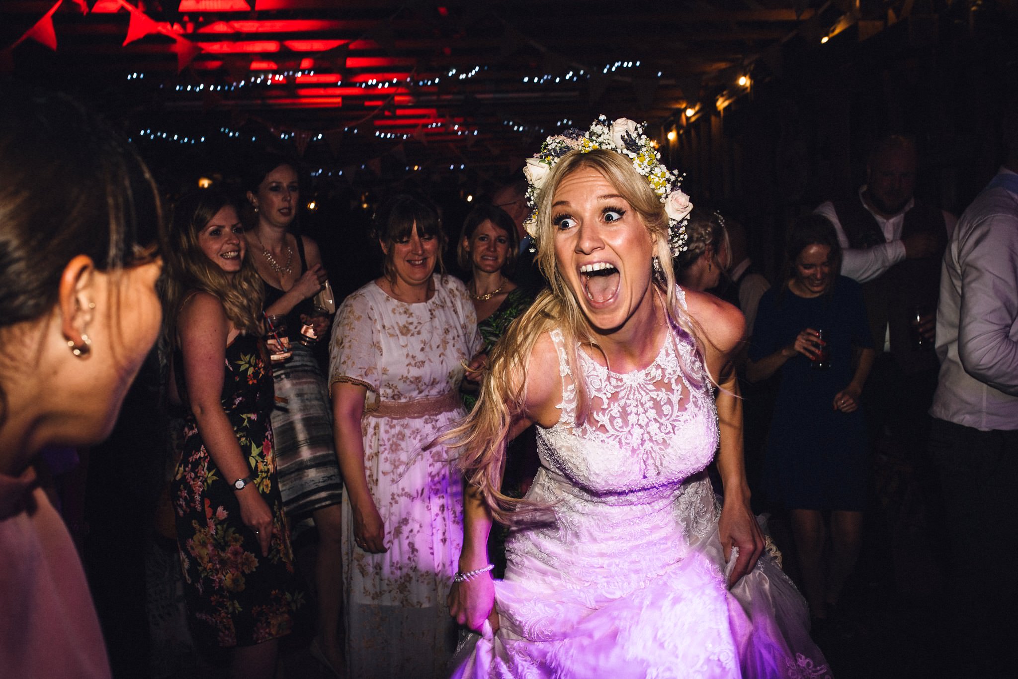 bride having fun on dance floor at wedding awards 