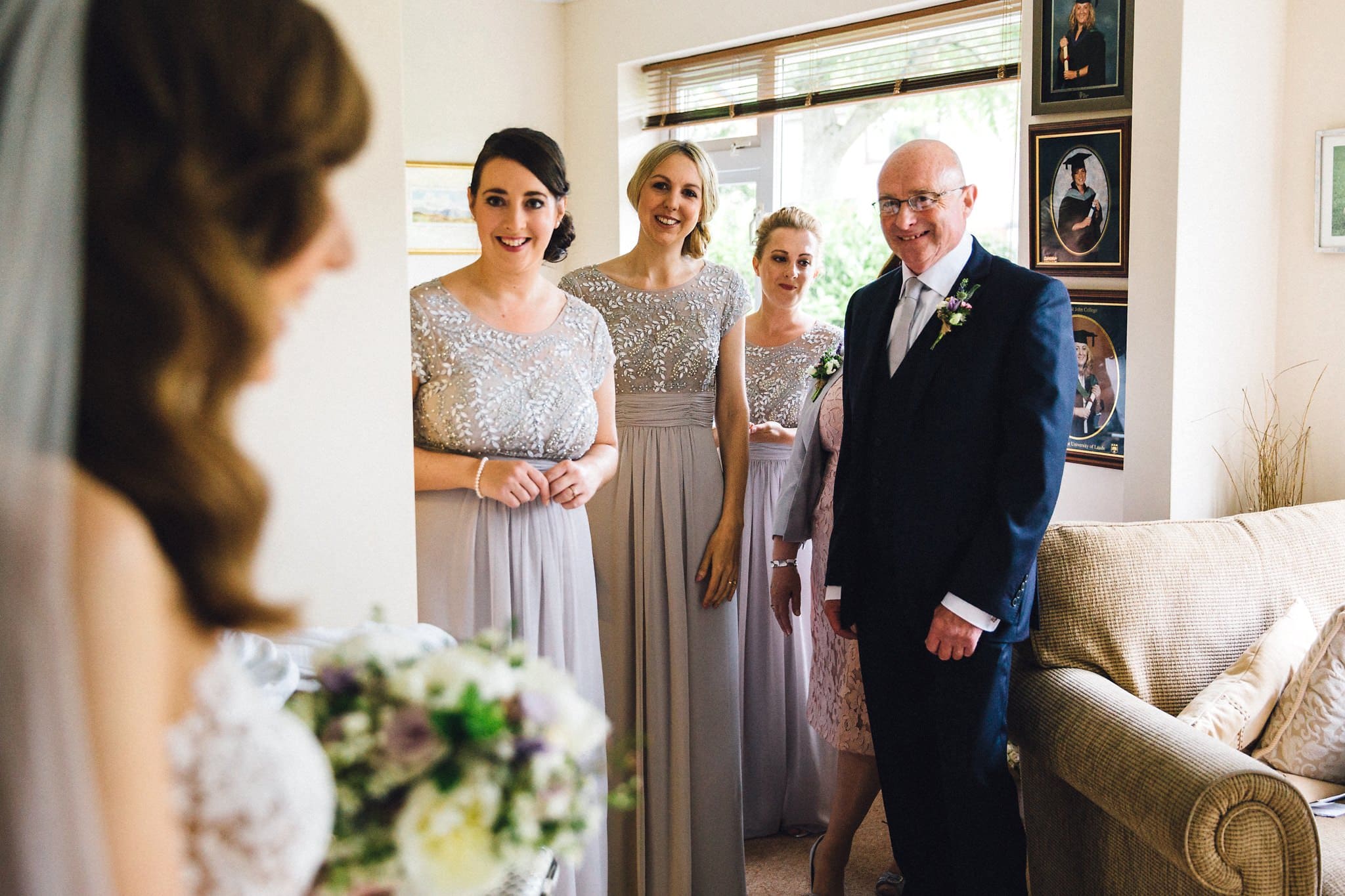 father of bride seeing daughter on wedding day