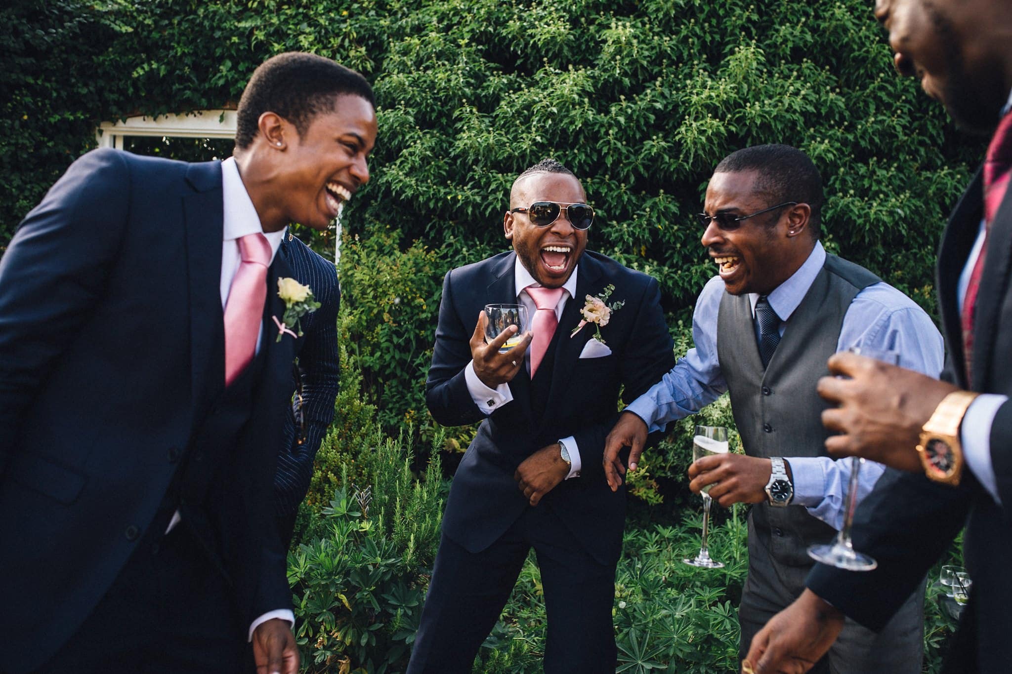 groomsmen laughing on wedding day