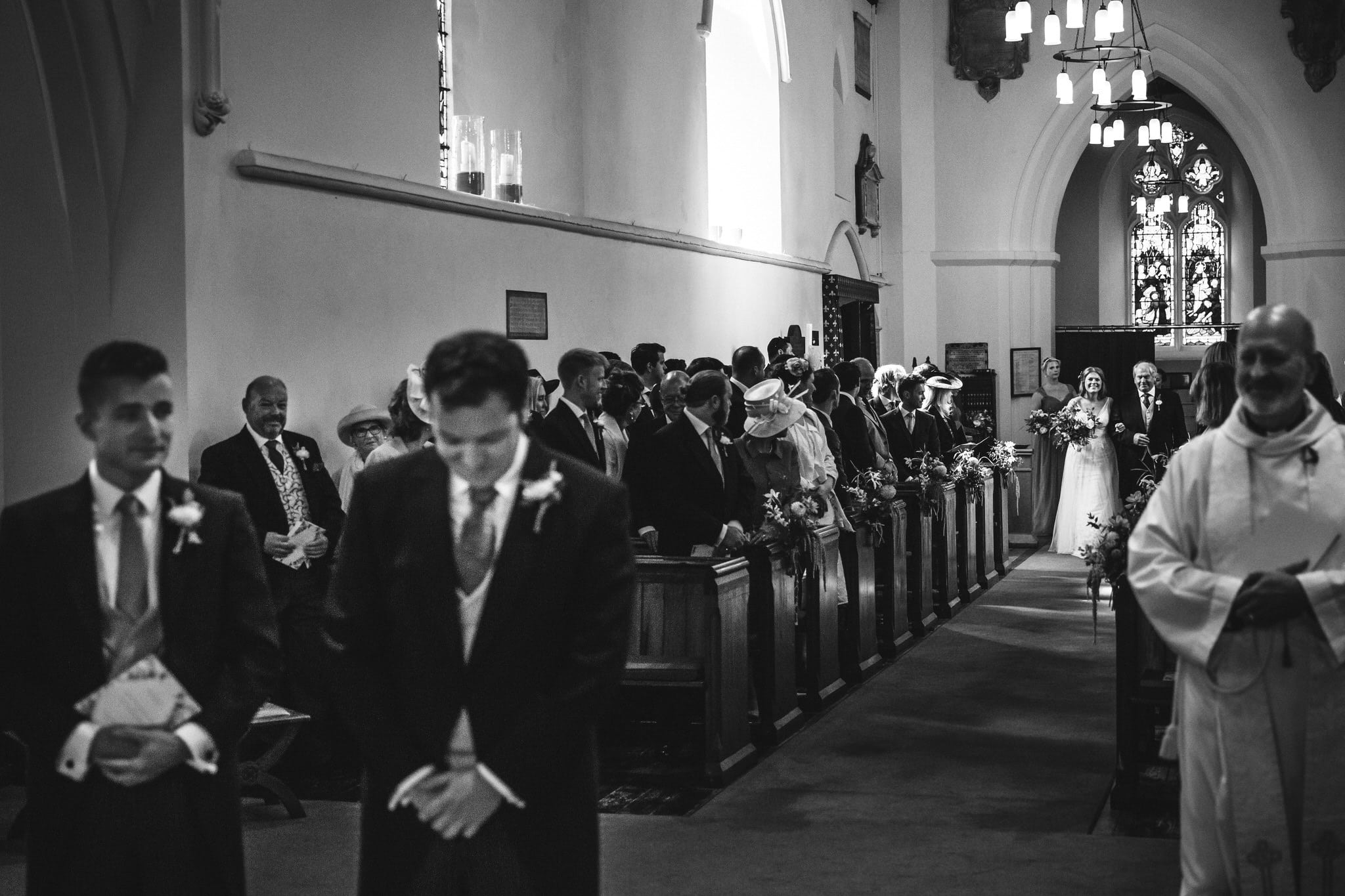 black and white image of bride's entrance to church