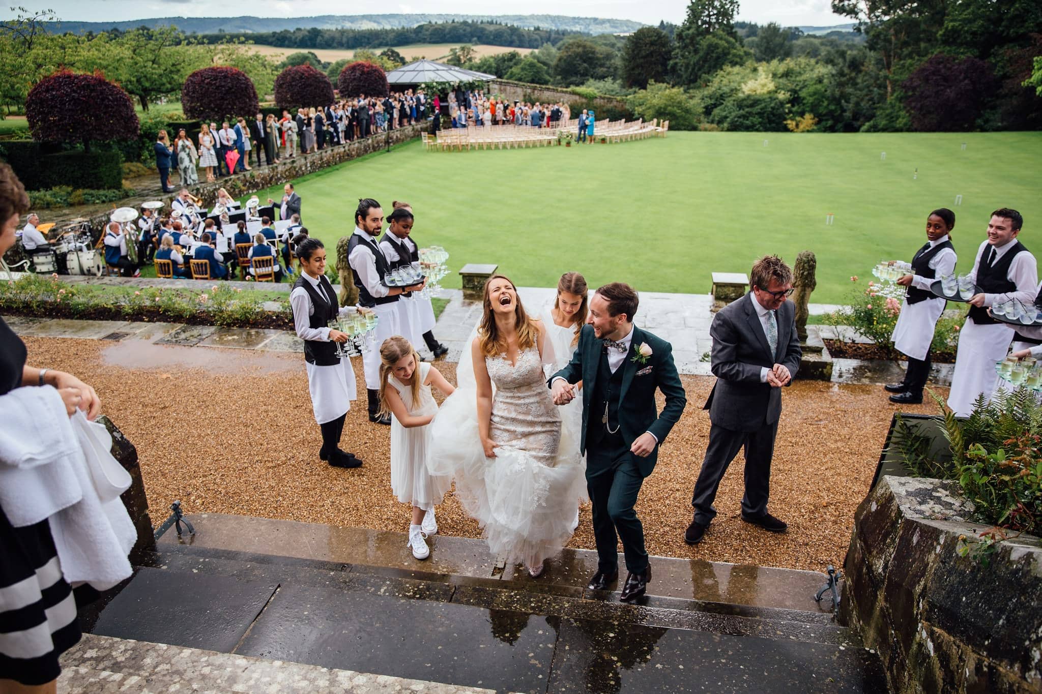 storm during outdoor wedding bride laughing