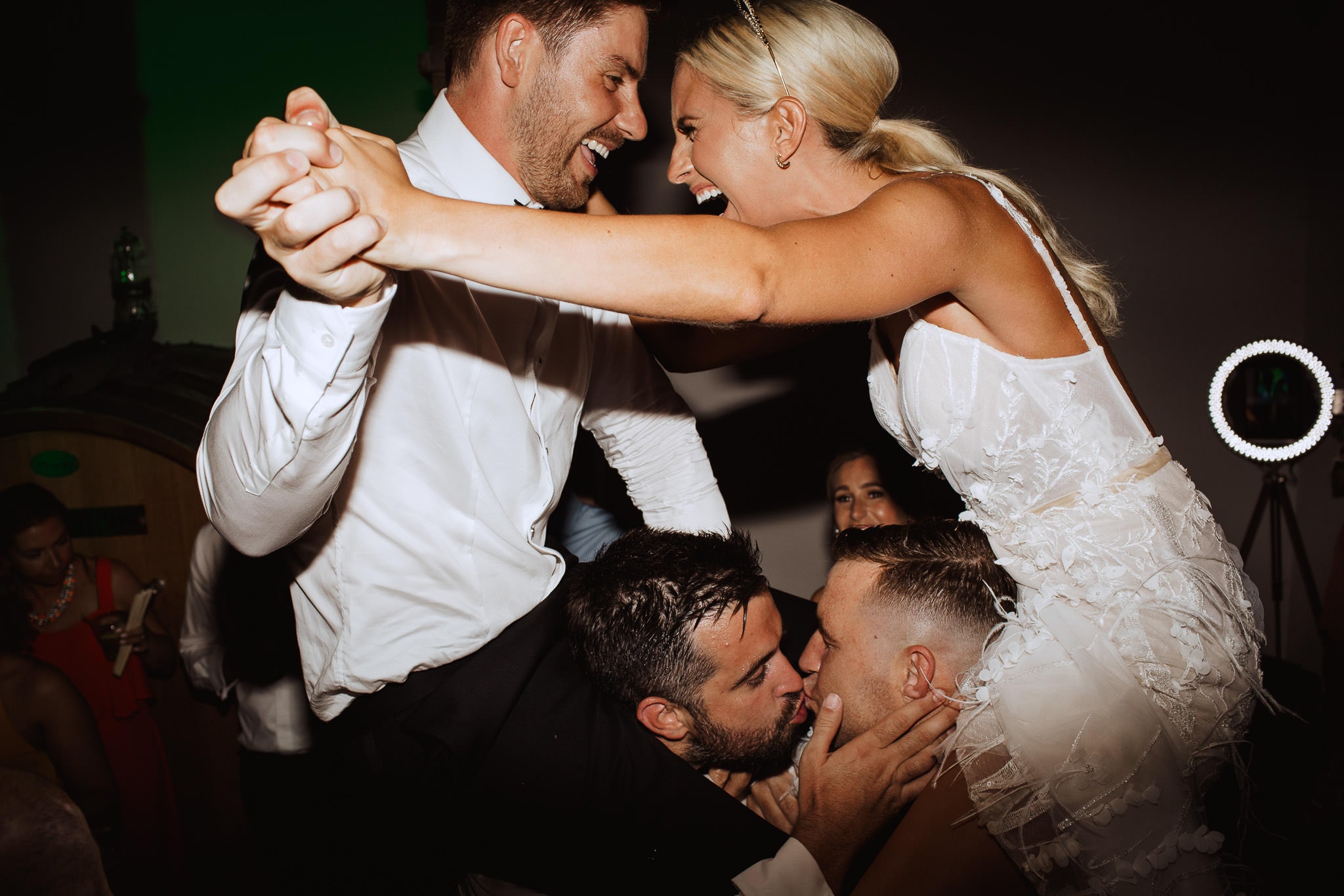 bride and groom in the air on the dance floor