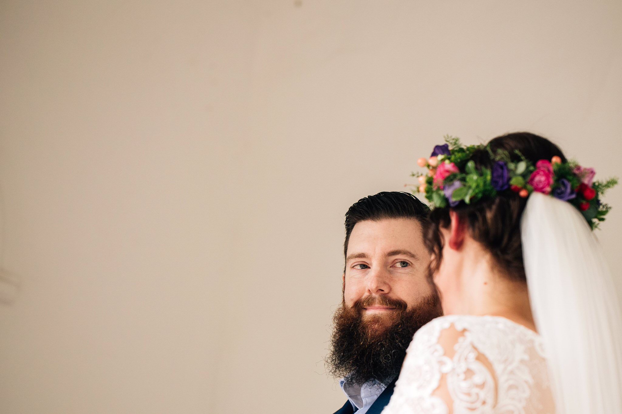 groom with beard against minimal backdrop