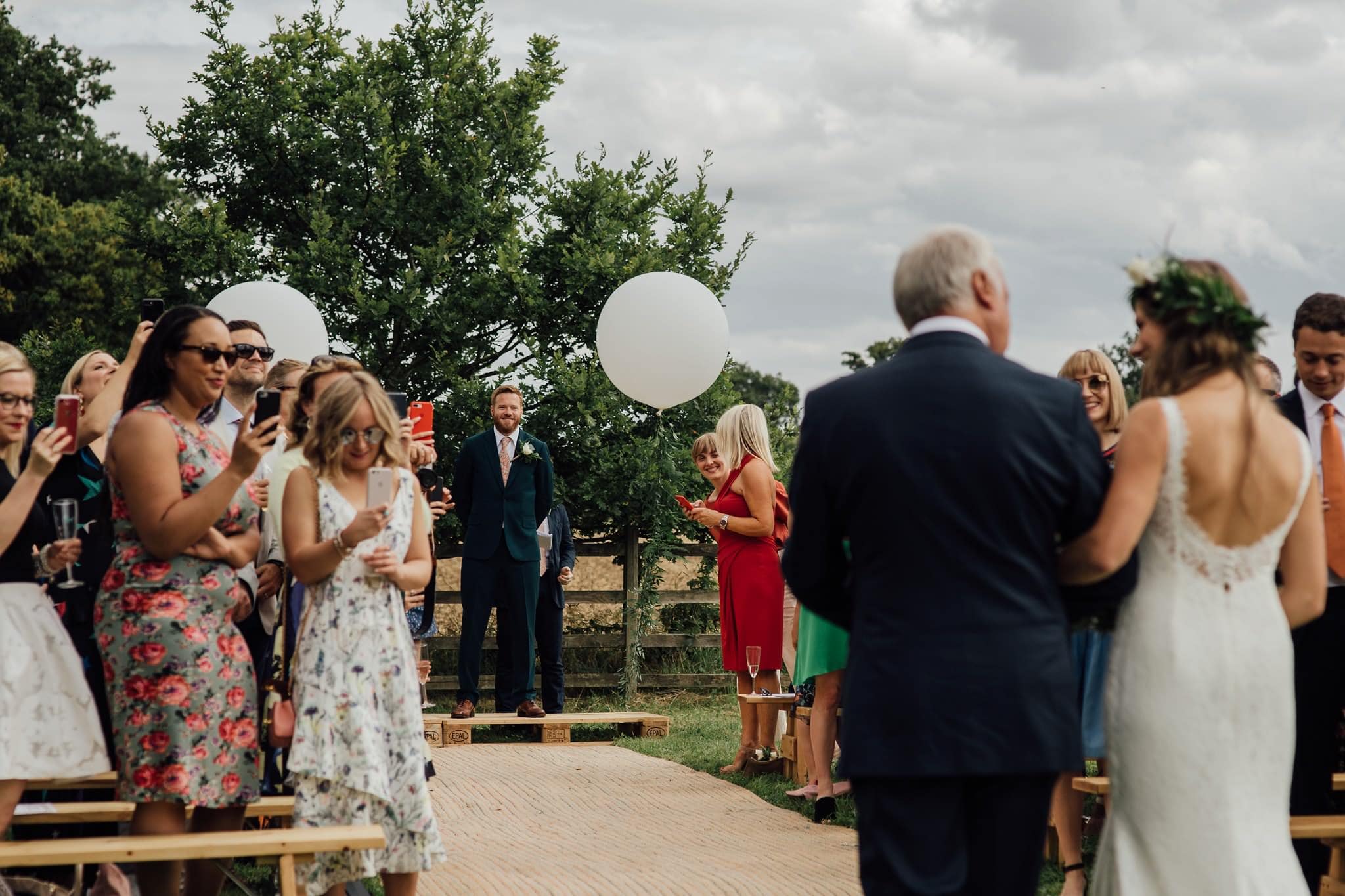 bride's arrival at outdoor ceremony