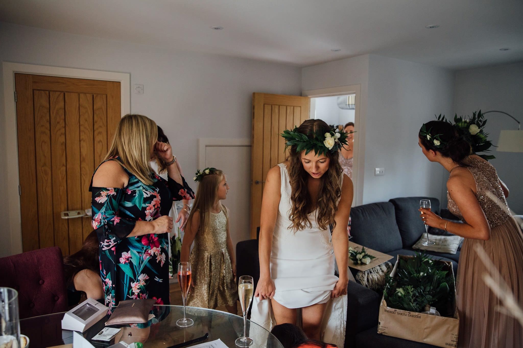 bride putting wedding dress on