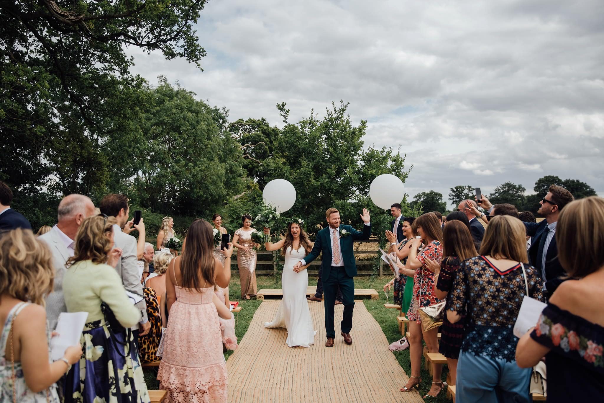 just married bride and groom high fives