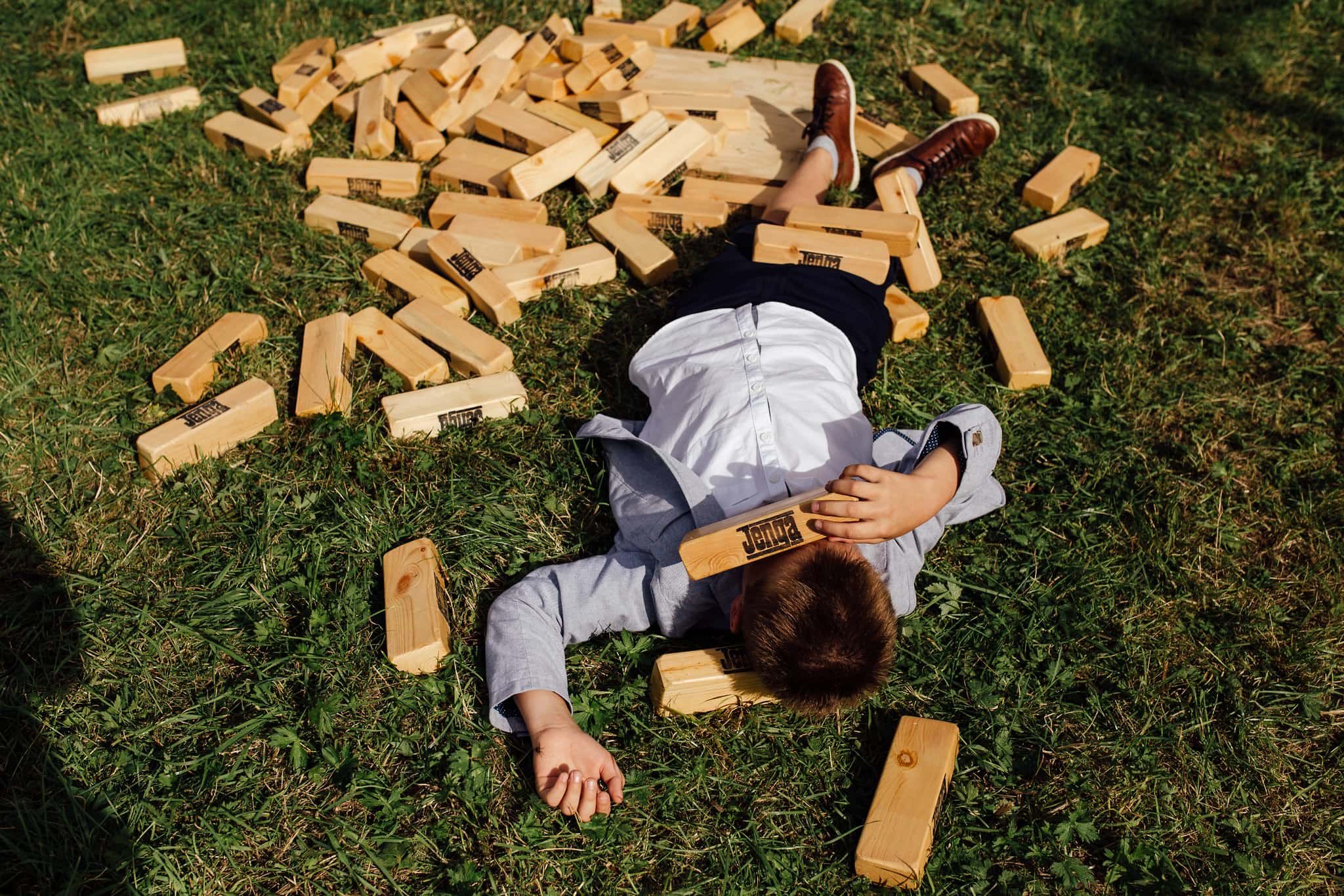 child under giant jenga 