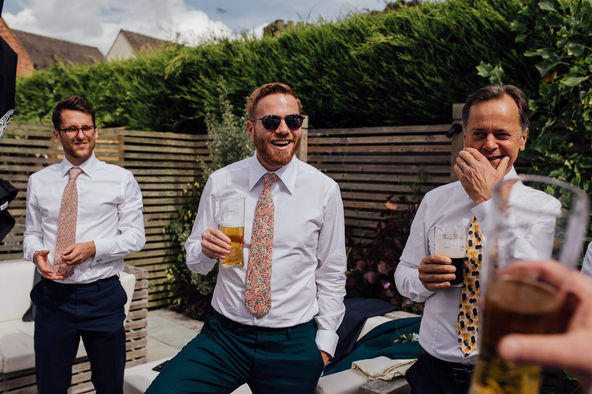 pre wedding drinks with groom in floral tie