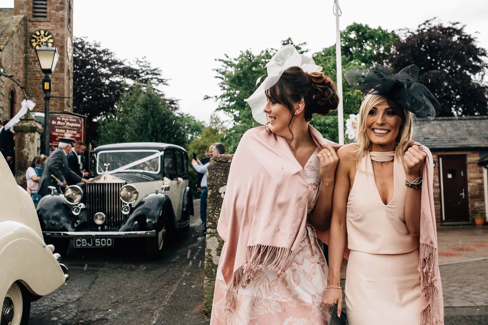 reportage shot of guests on rainy wedding day