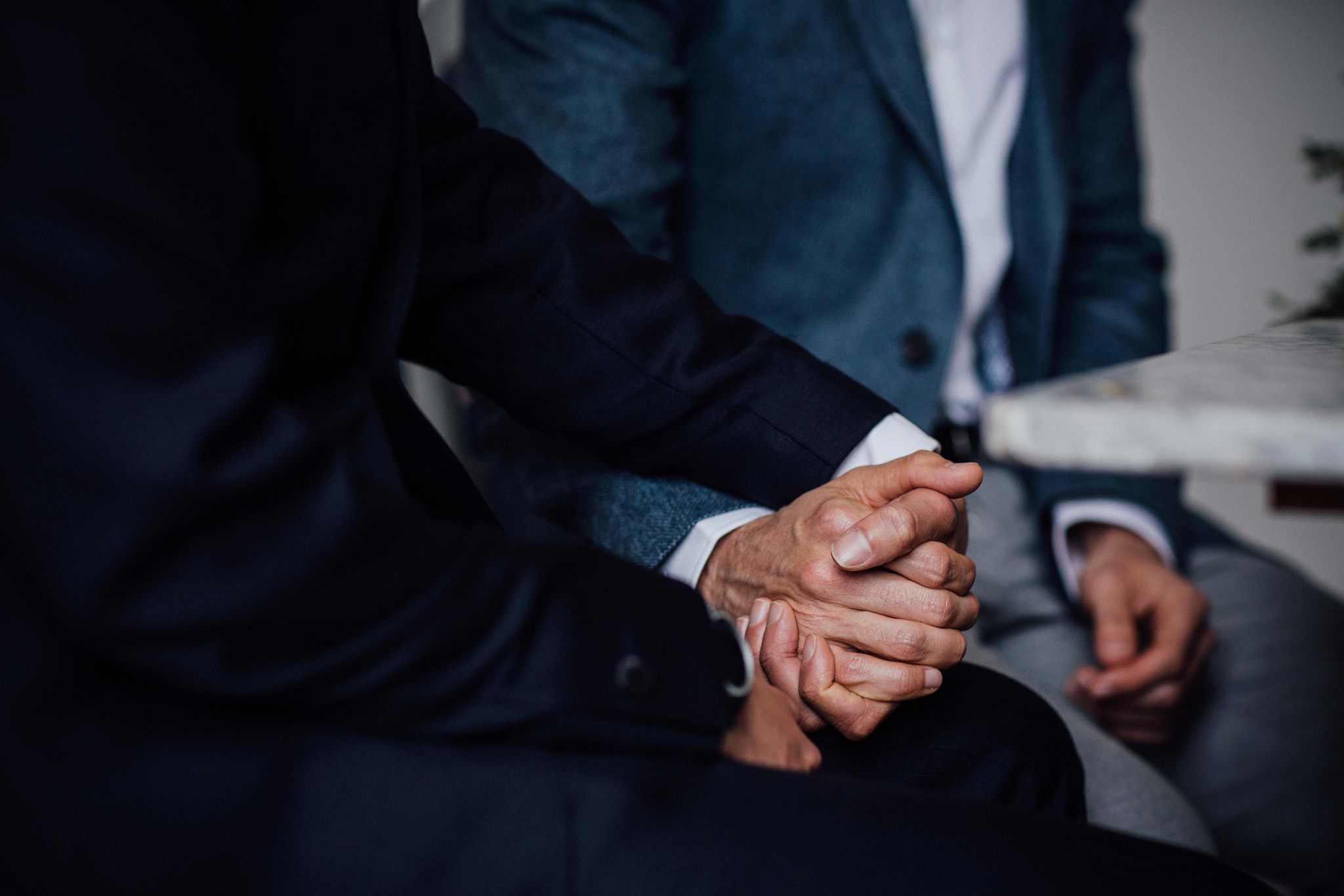 two grooms holding hands