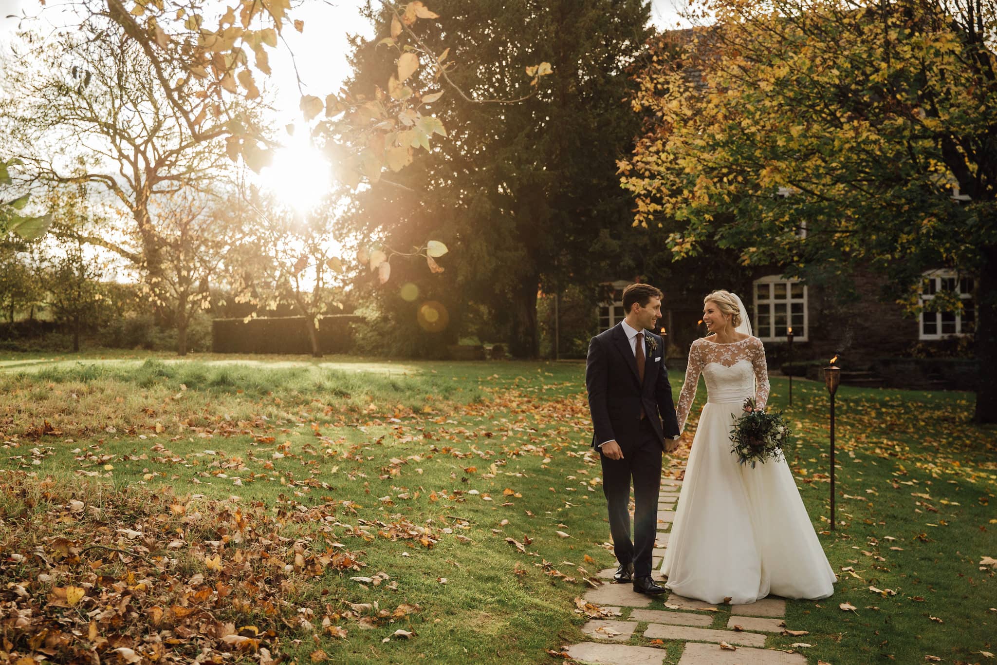 sunset bride and groom walking