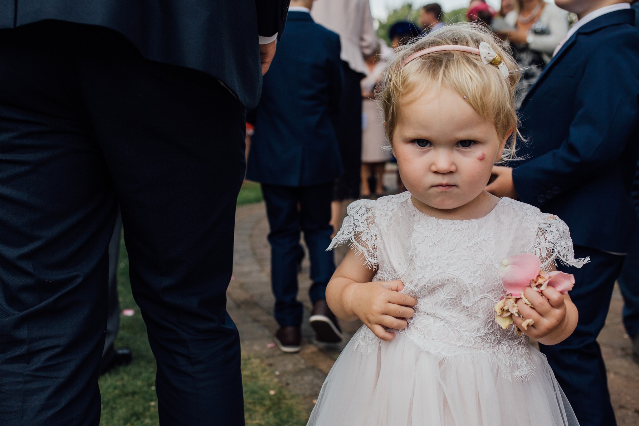 not happy kid at wedding