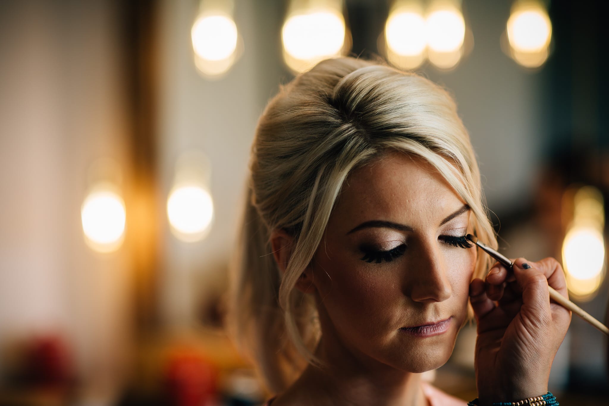 bridal makeup lit with glowing festoon lights