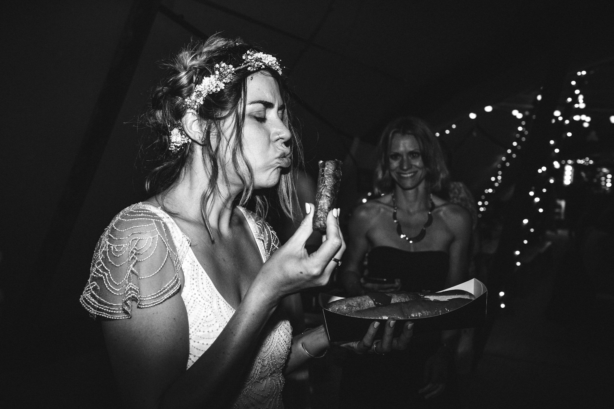 bride eating a sausage on the dancefloor