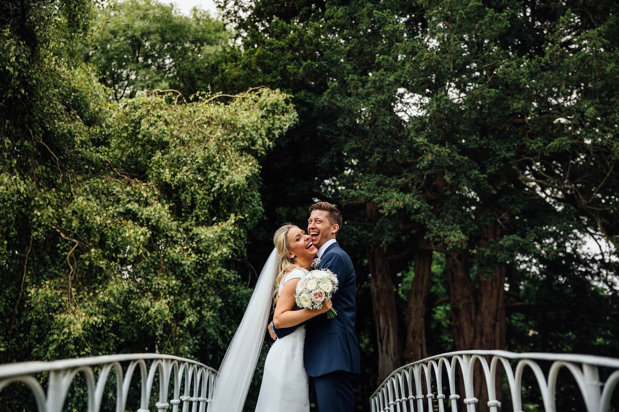 bride and groom portrait on bridge