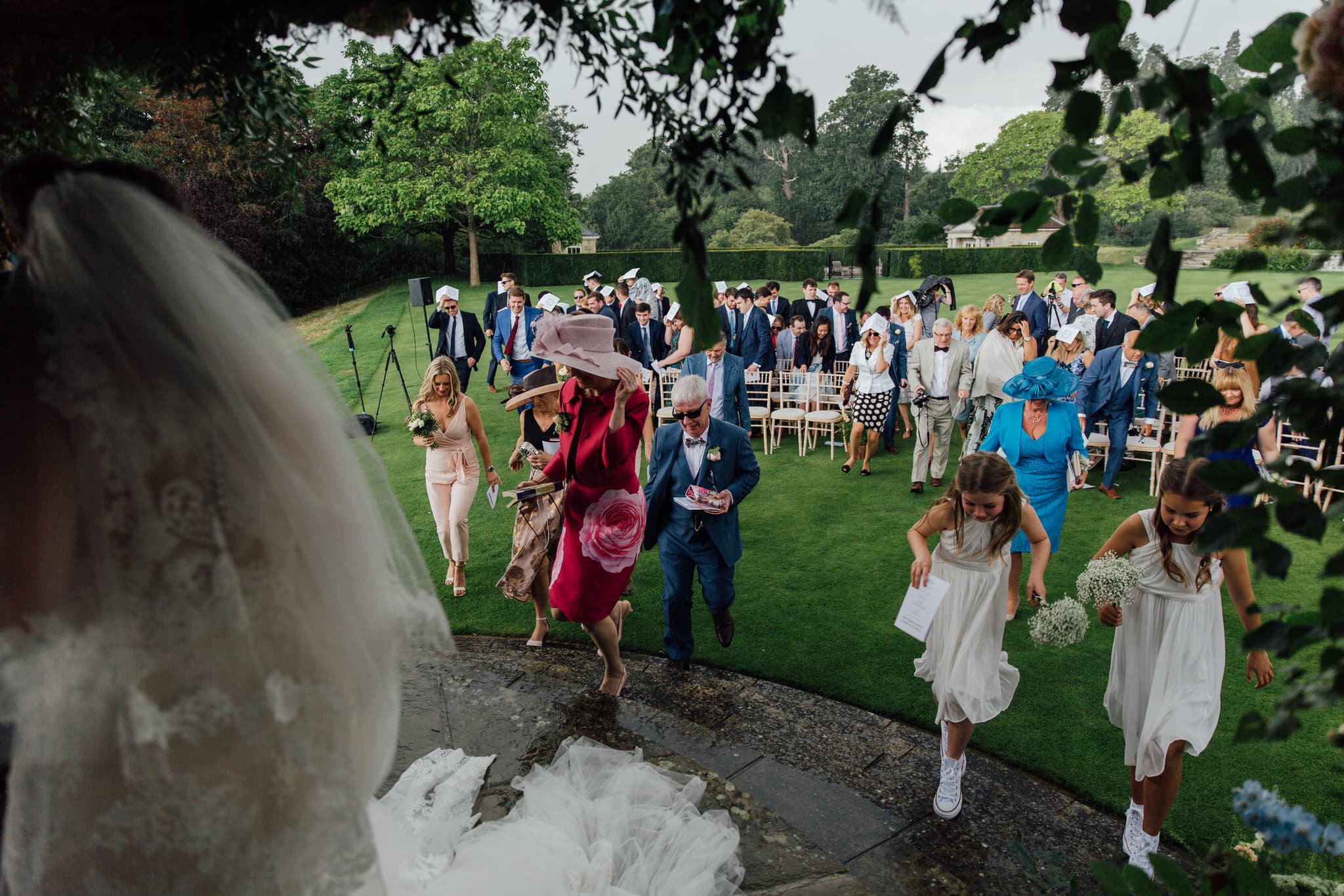 cowdray house wedding ceremony in the rain