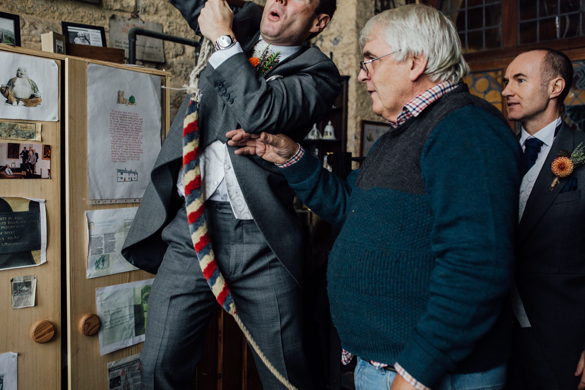 groom ringing bell at church