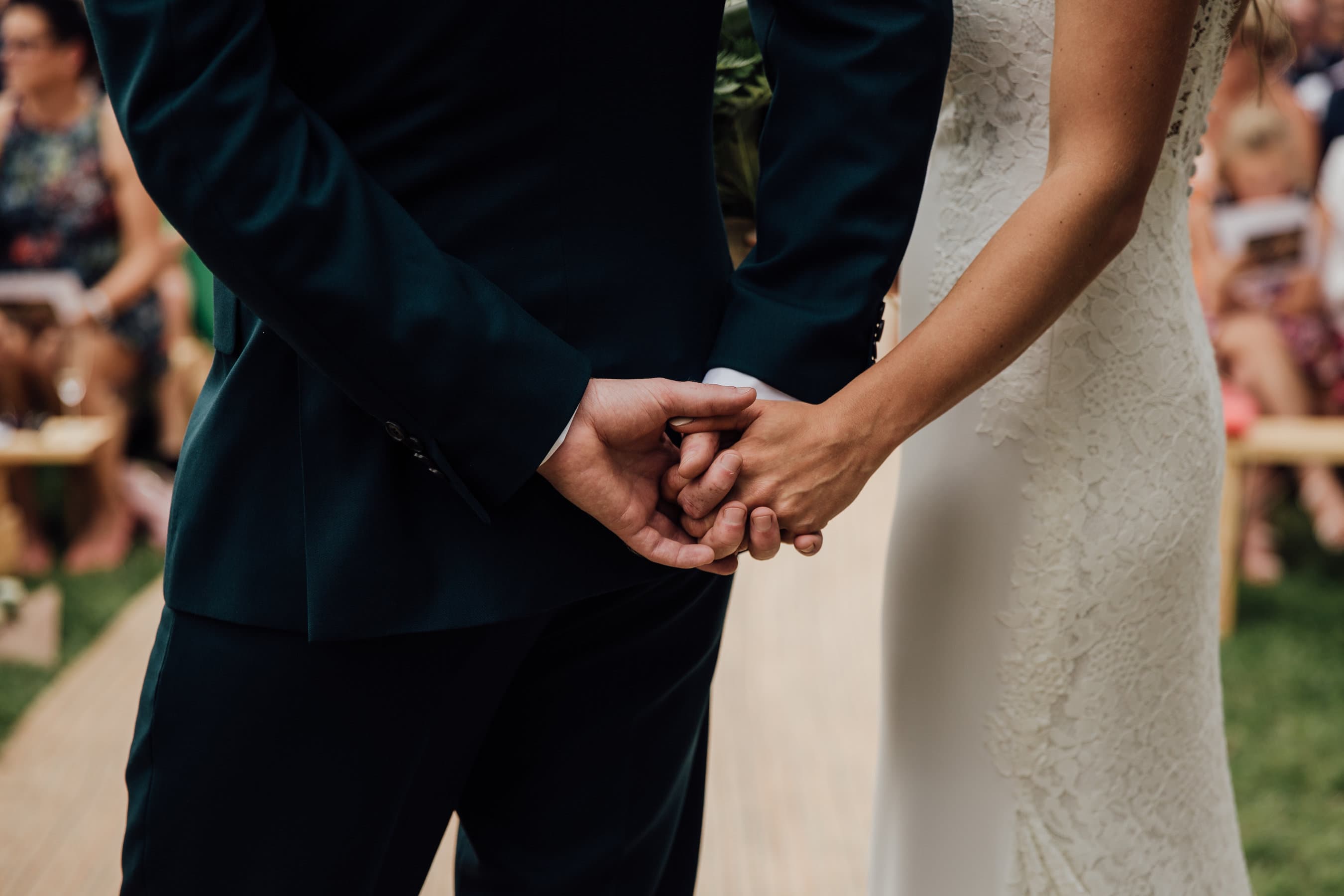 bride and groom holding hands