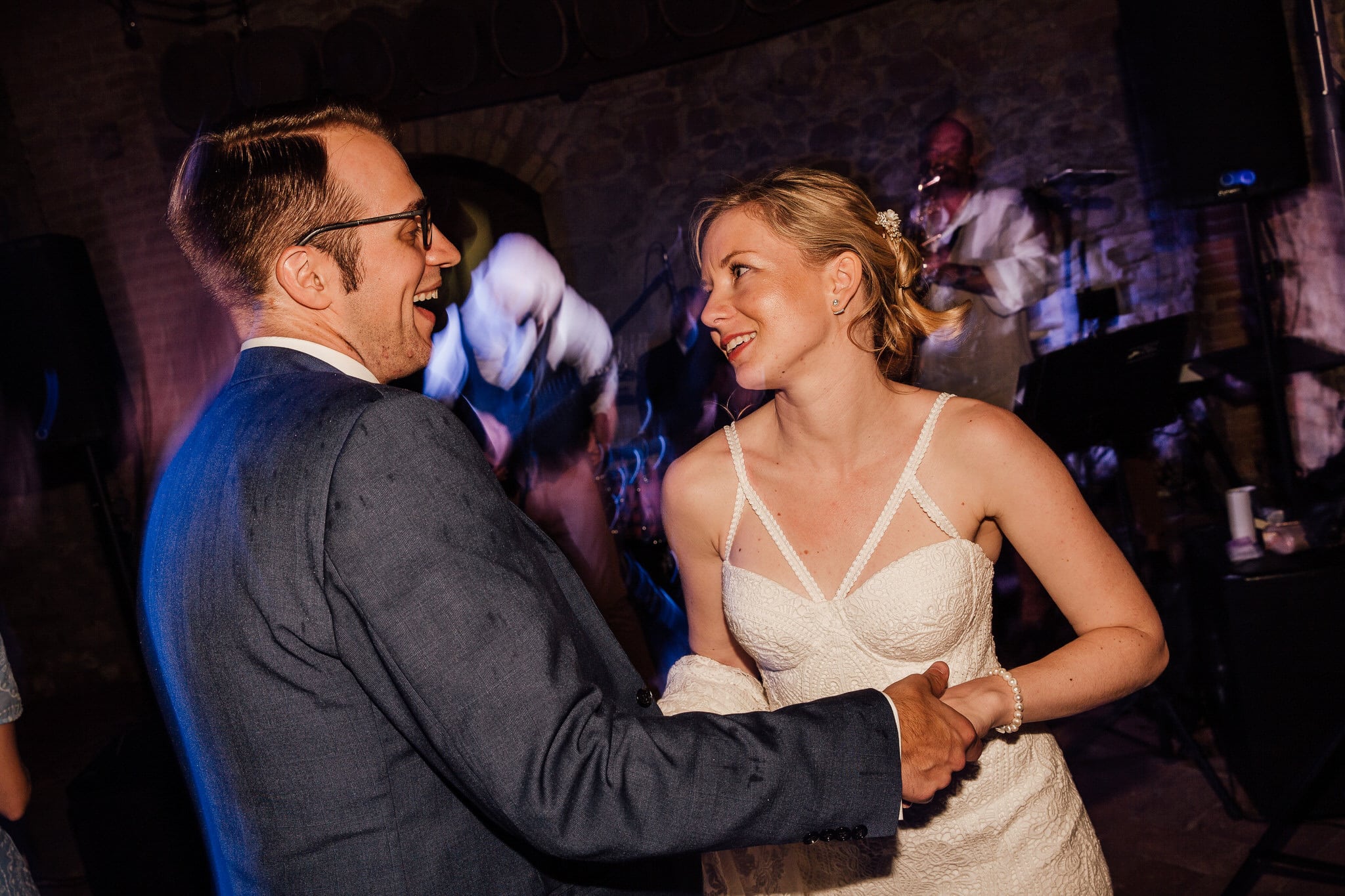 bride and groom dancing disco lights