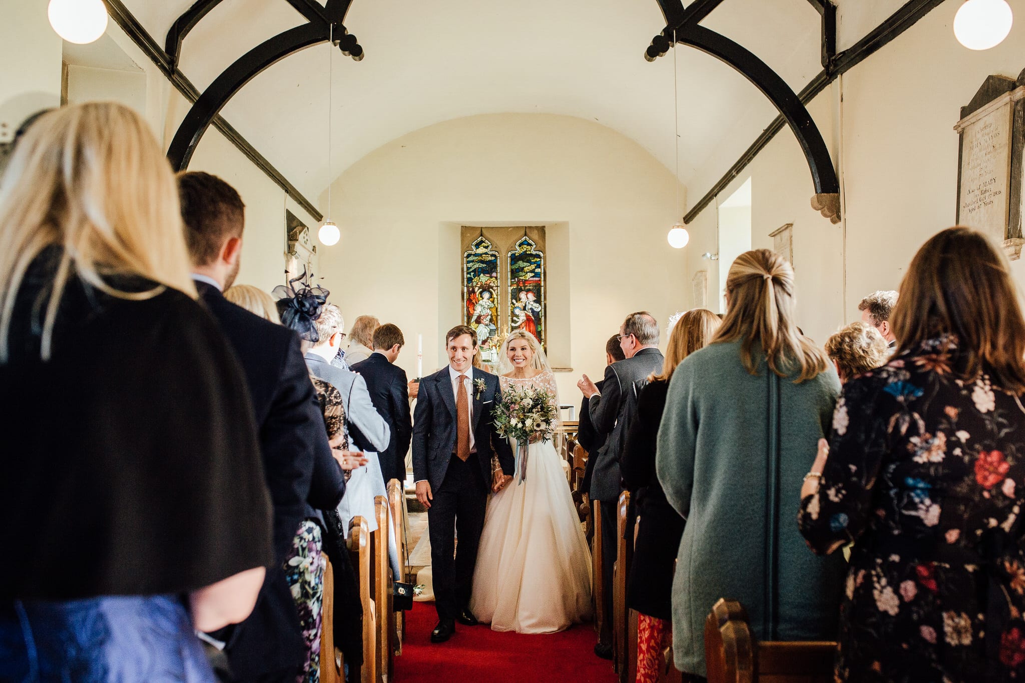 just married the bride and groom exit the church