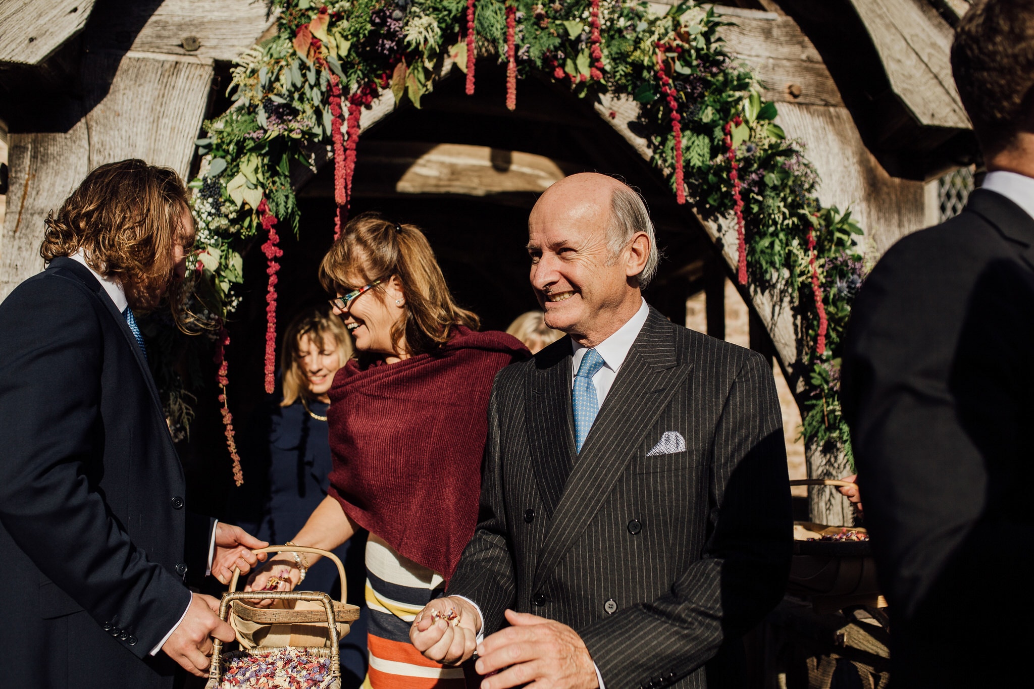 guests with confetti in Autumn light