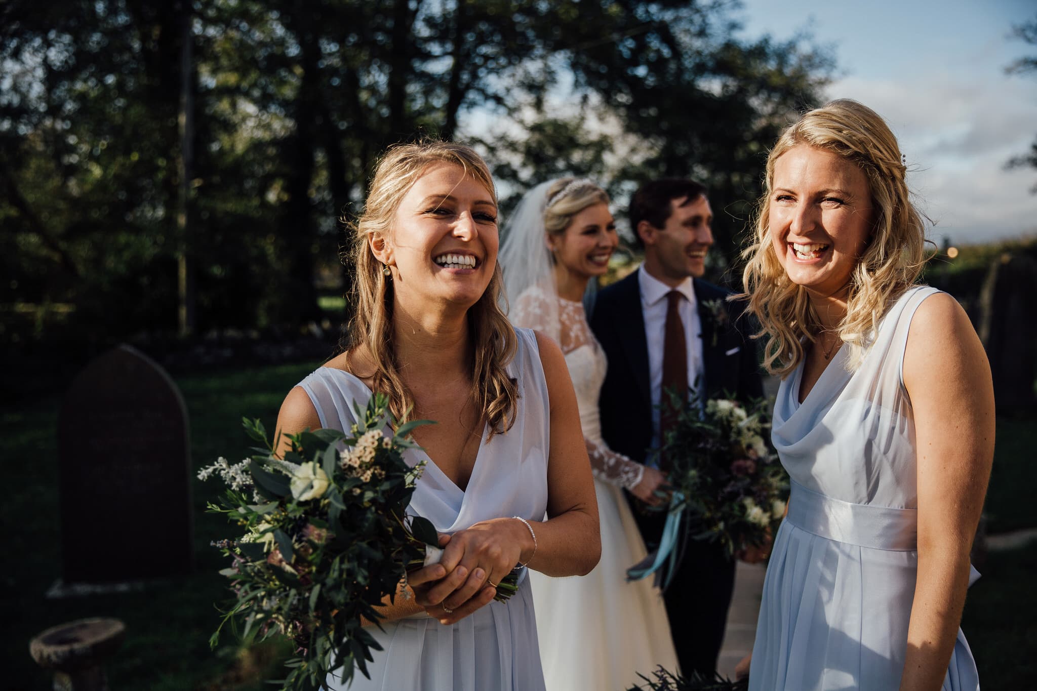 bridesmaids laughing at Dewsall Court