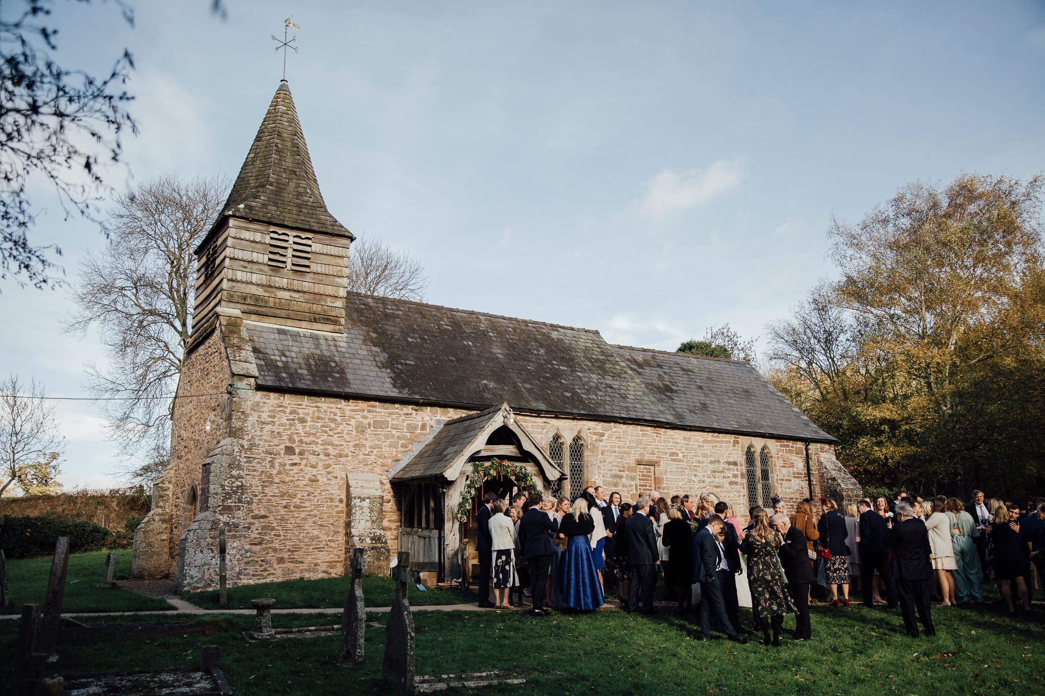 guests gathered in front of church