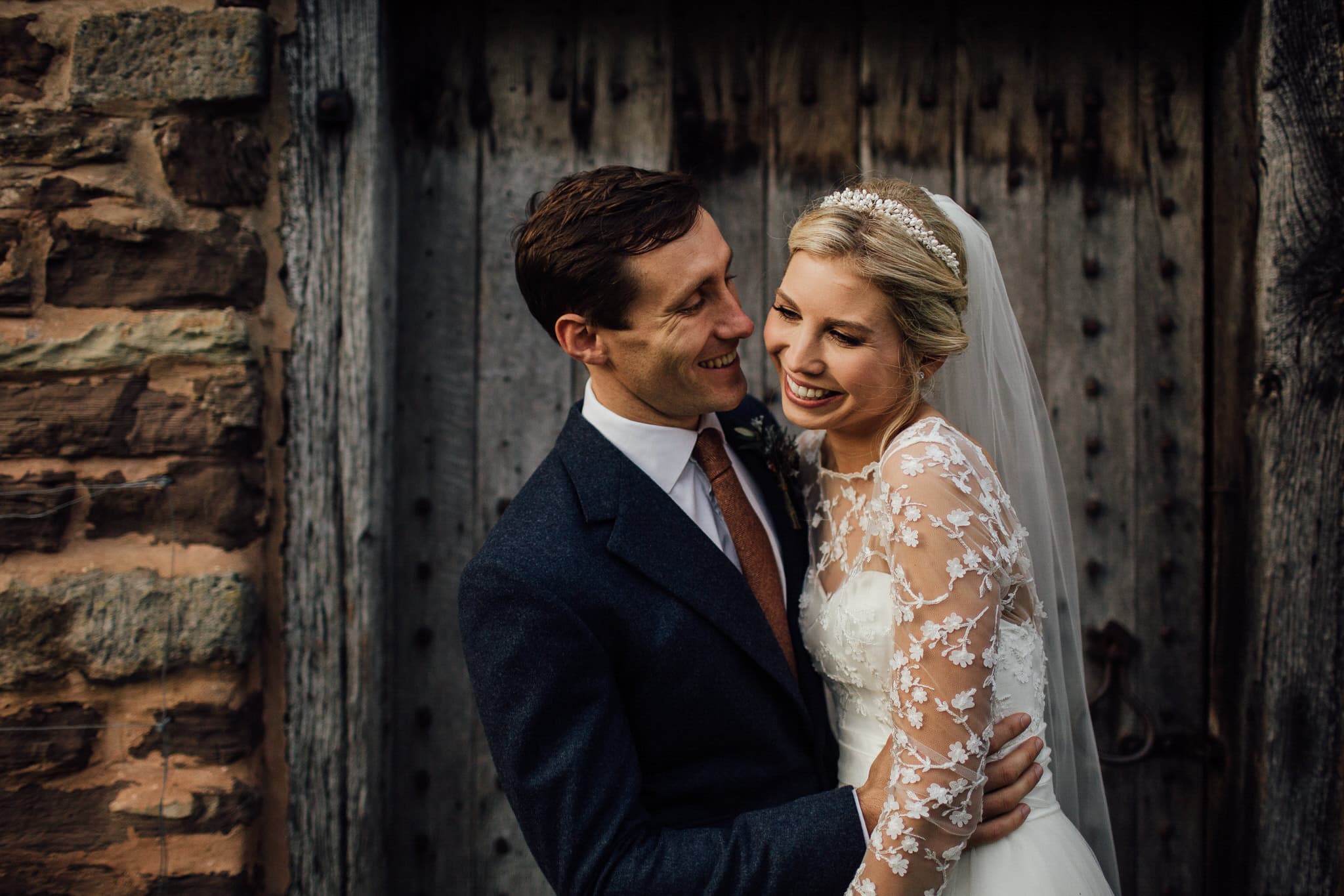 natural portrait of bride and groom laughing