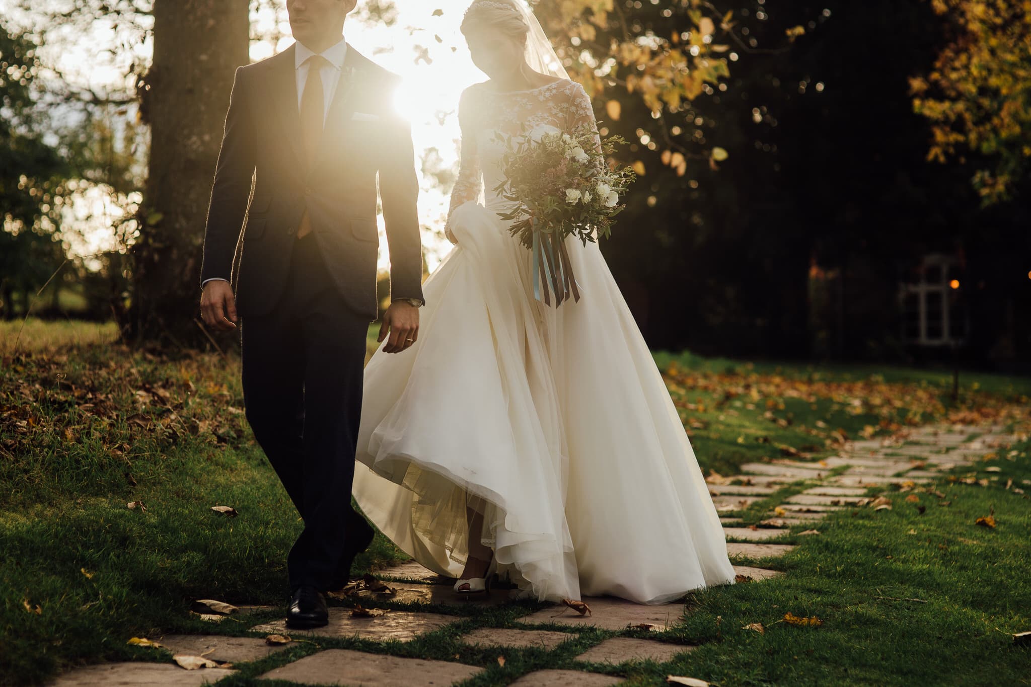 documentary photo of bride and groom in sunset