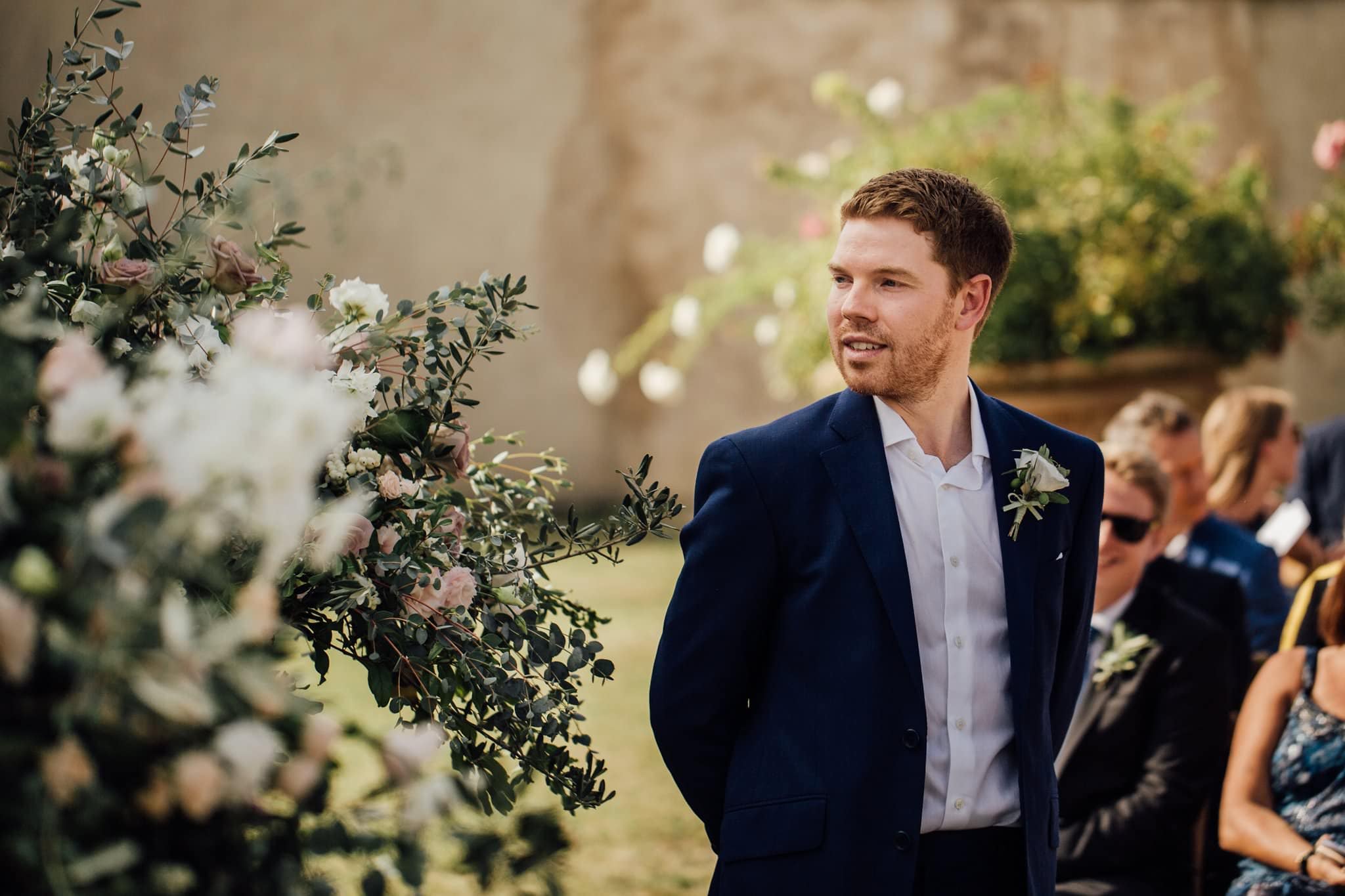 close up of groom waiting for bride