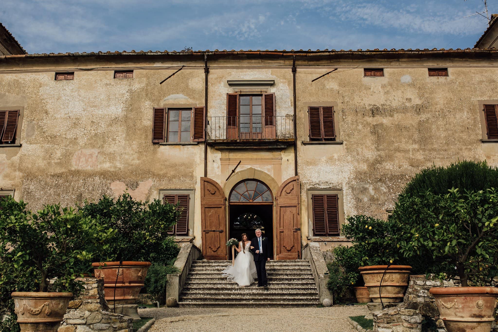 bride on steps at Villa Medicea di Lilliano, Florence Italy