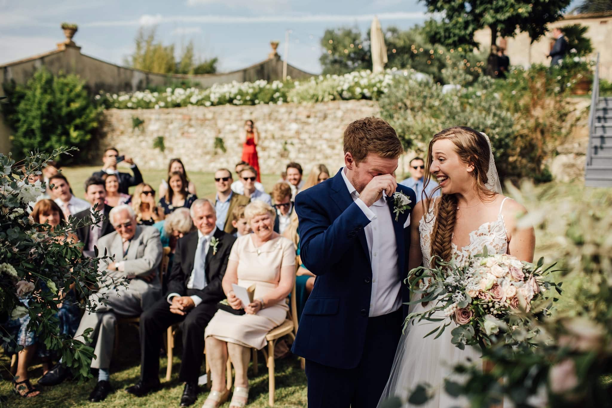 documentary shot of groom crying during ceremony