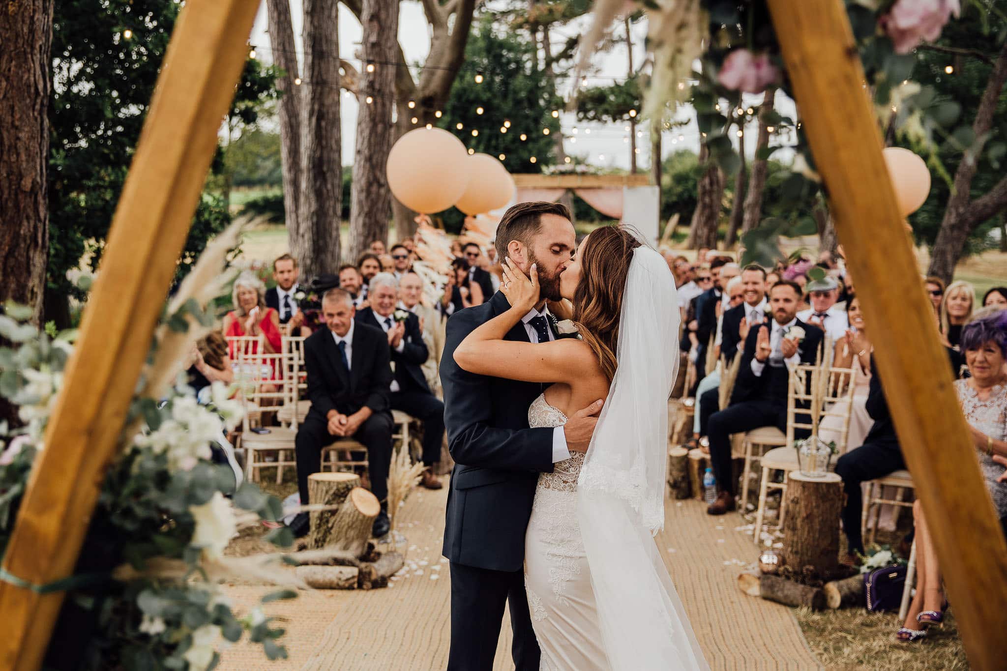 first kiss outdoor tipi wedding