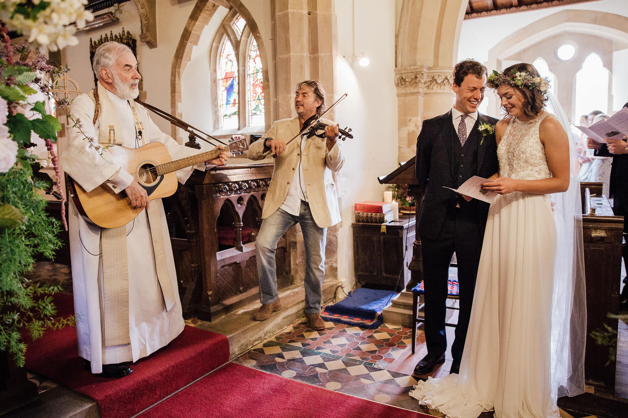 church wedding with vicar on guitar