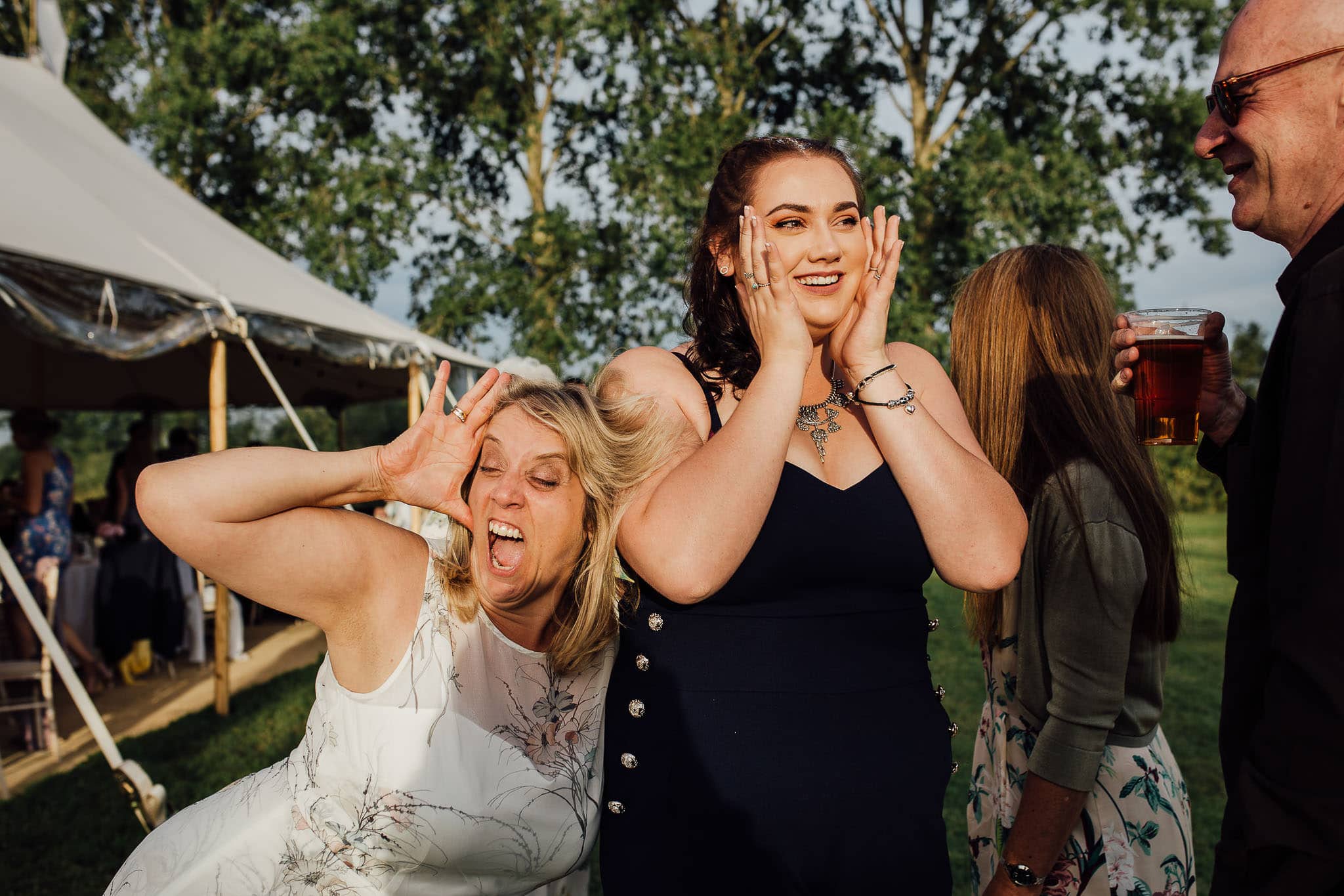 guests having fun at marquee wedding