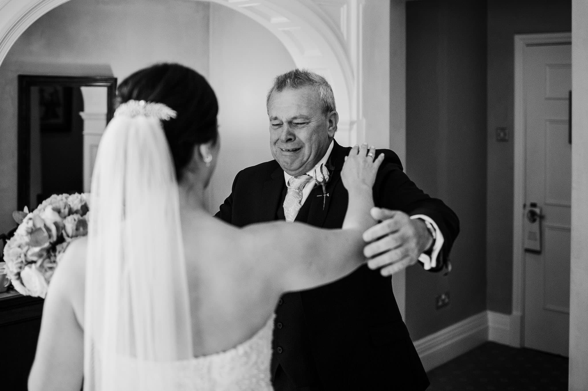 father of the bride emotional first look at wedding dress