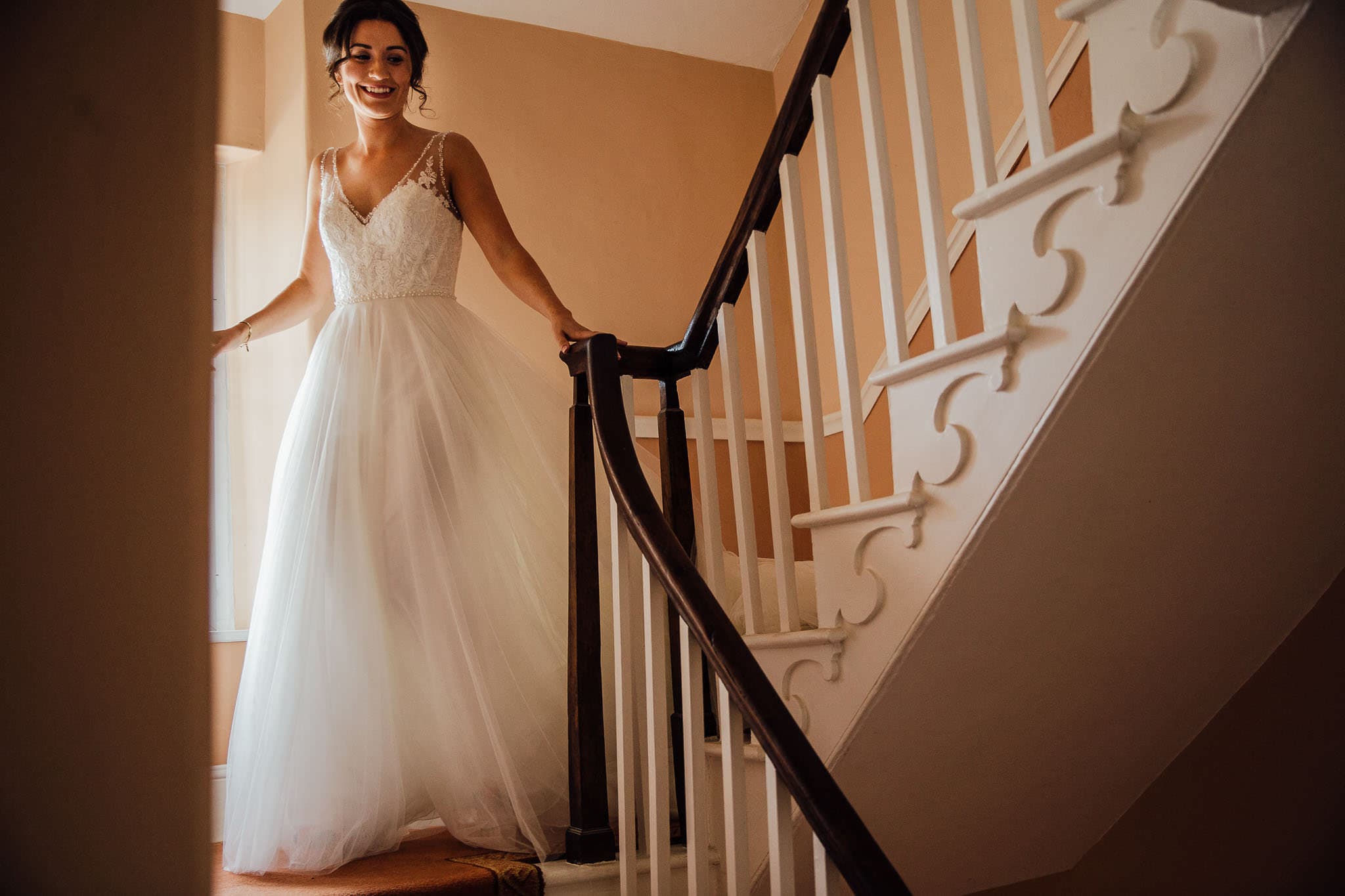 homespun wedding bride walking down the stairs