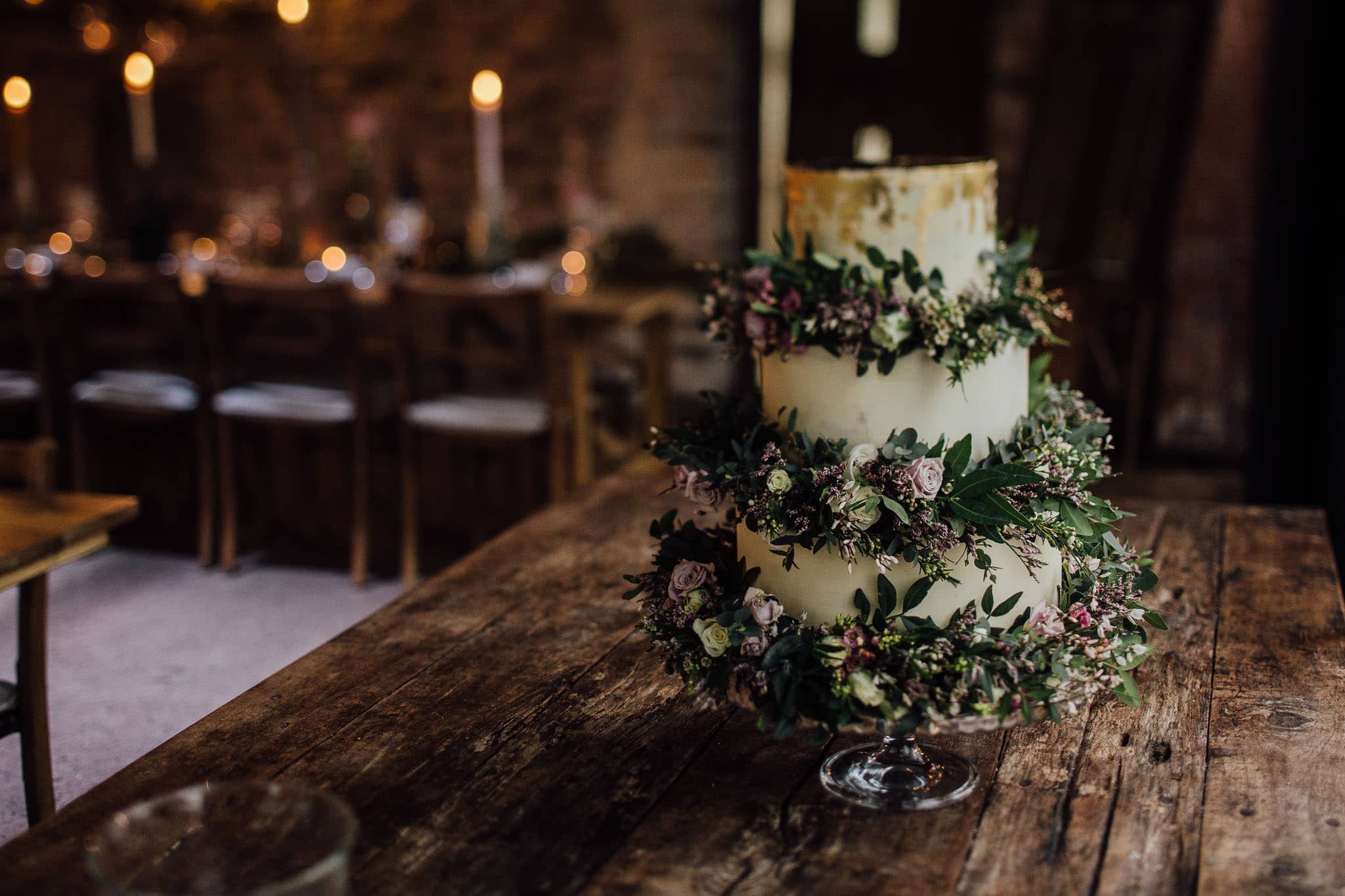 wedding cake decorated in purple flowers