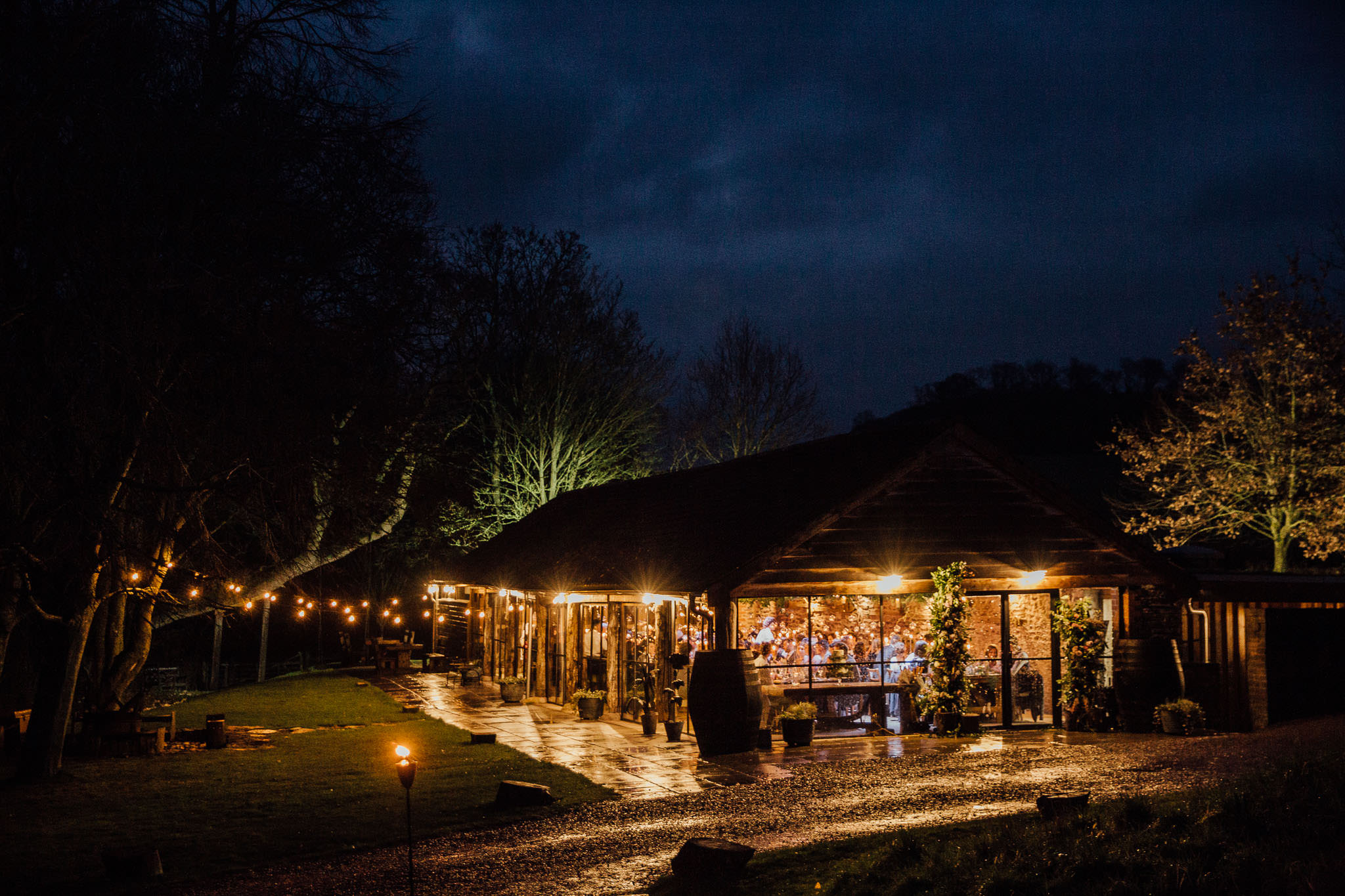 night time shot of barn with festoon lights