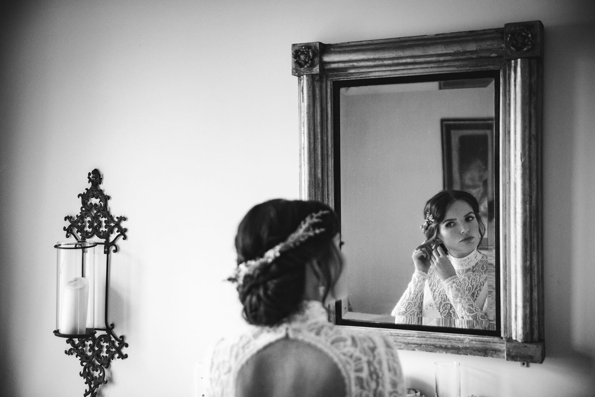 bride in lace gown wearing hair vine