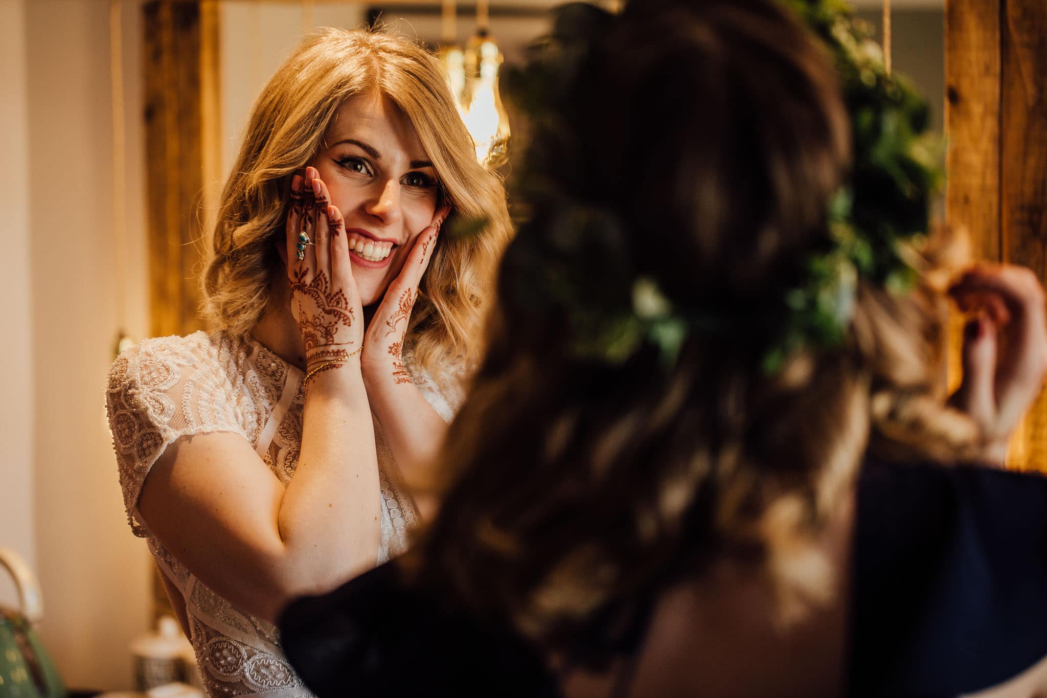 excited bride with henna hands