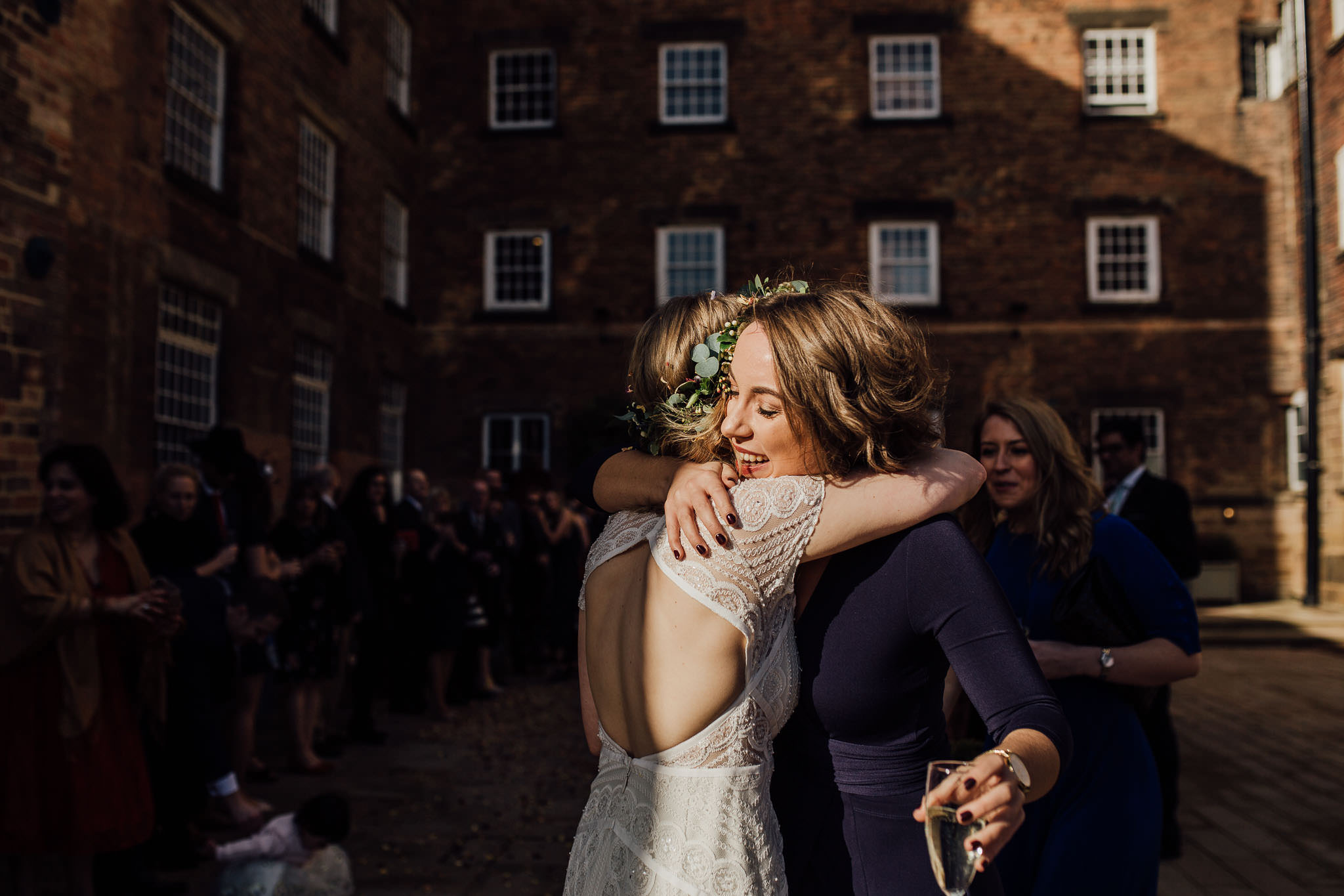 bride cuddling friend