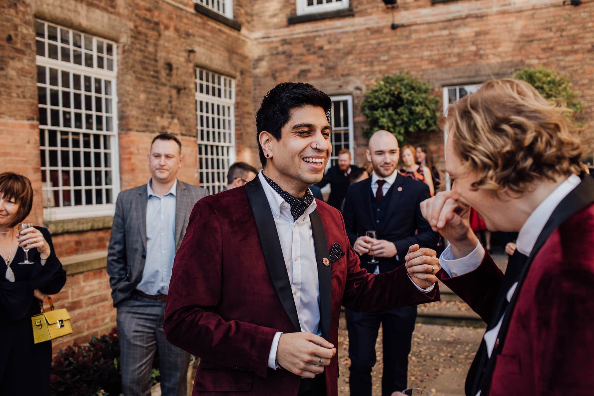 groom laughing with best man