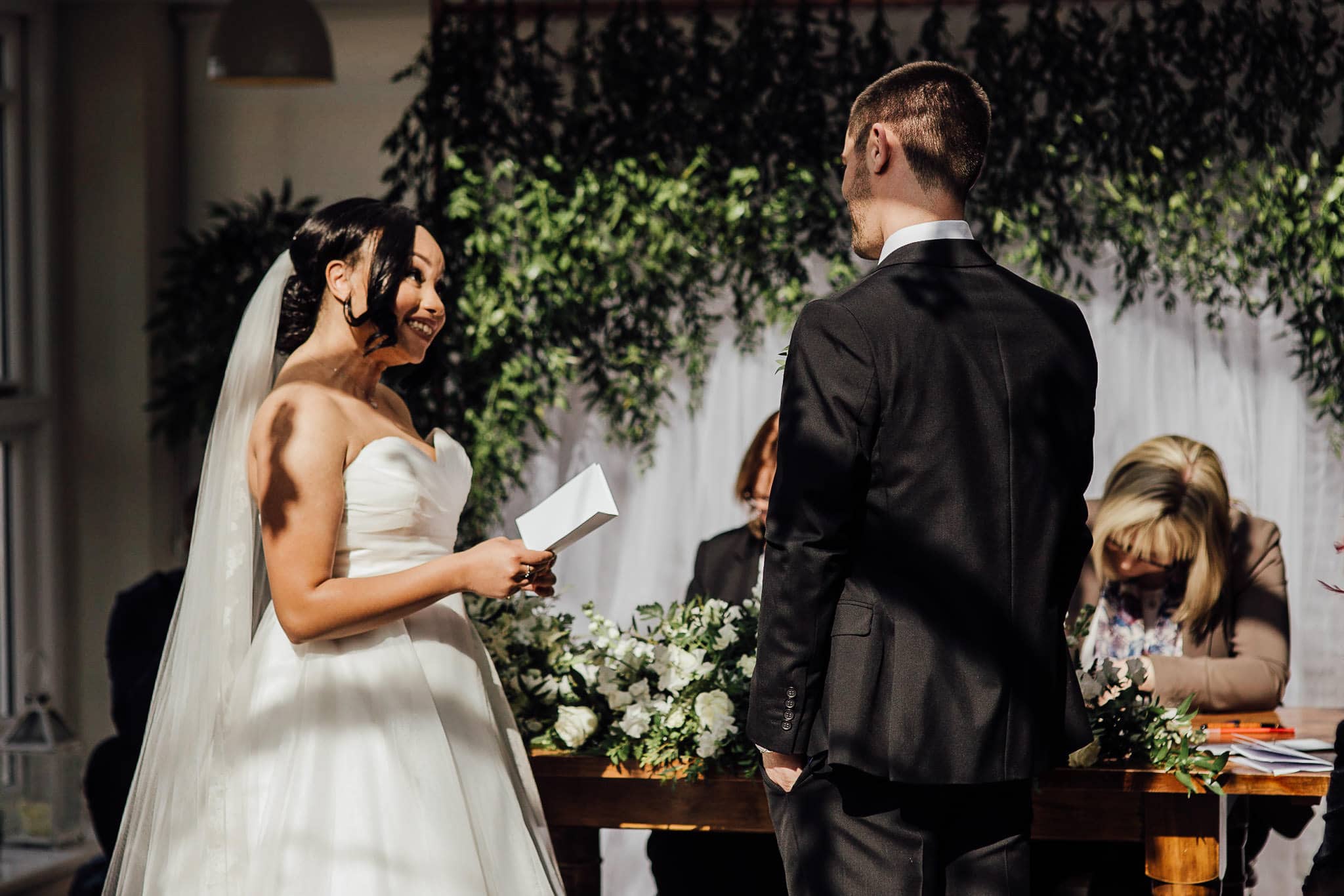 bride reading personal wedding vows