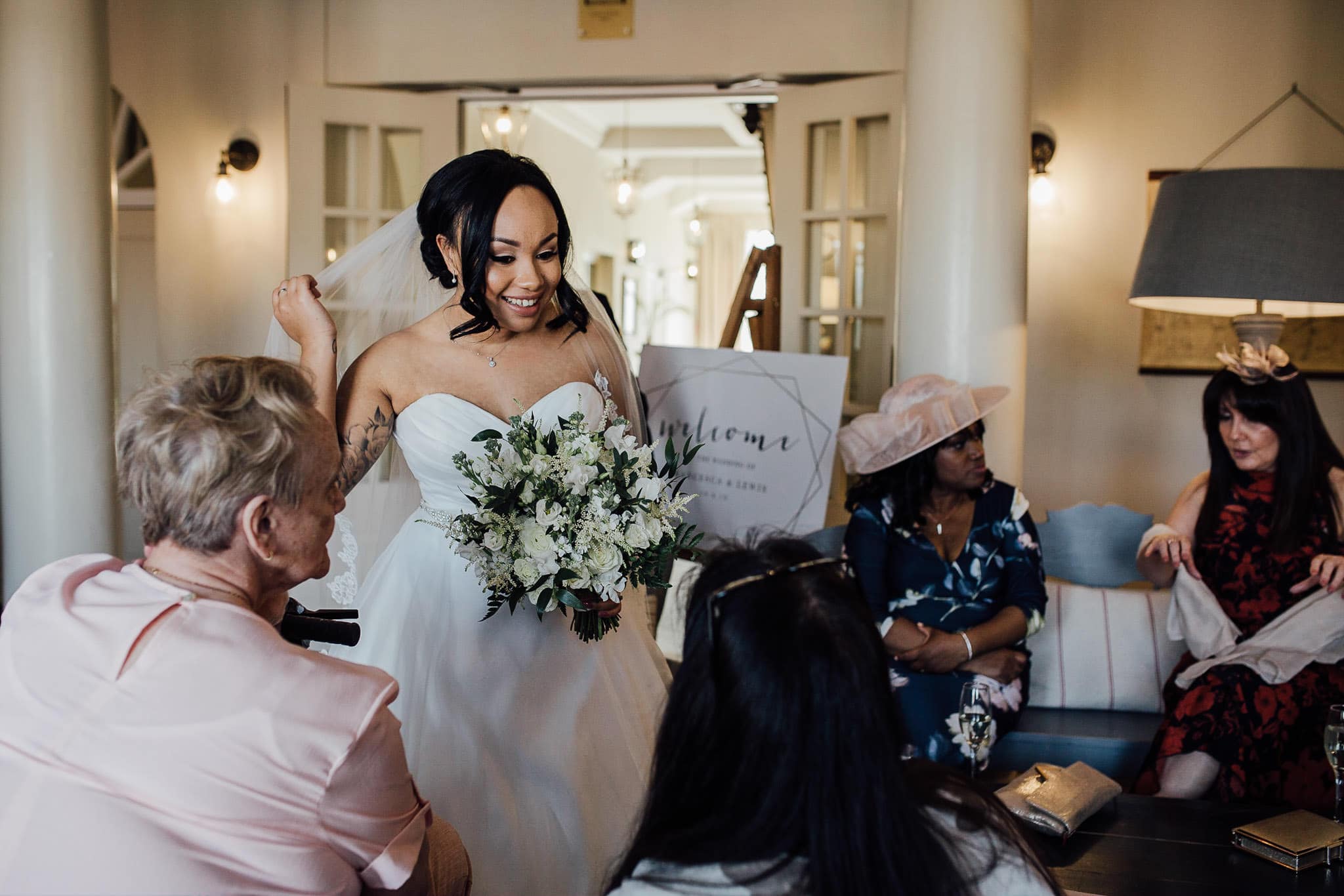 natural wedding photo of bride and family