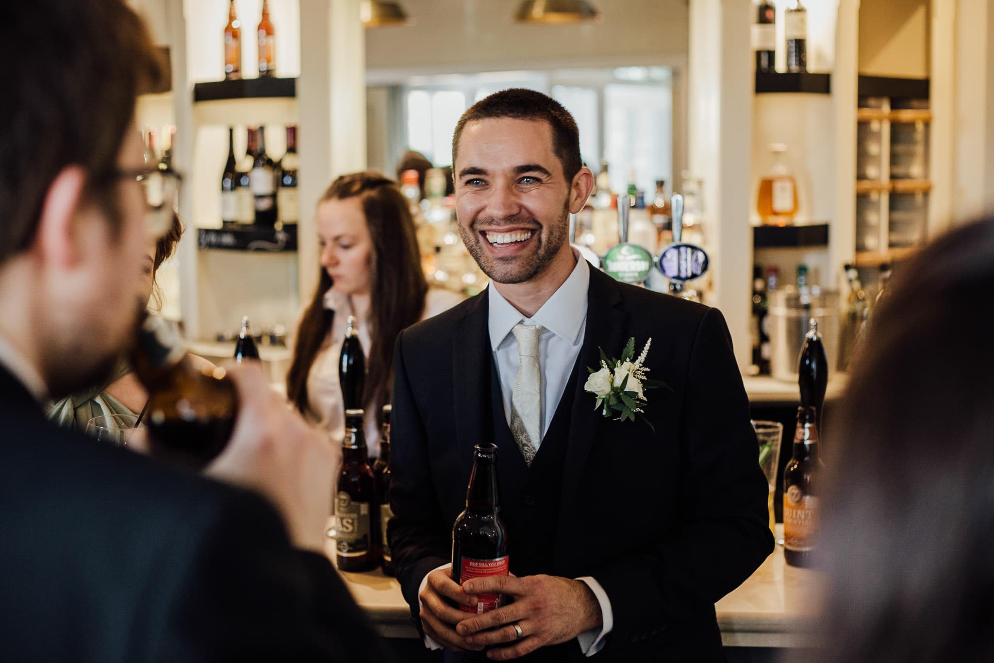 smiling groom at derby wedding reception