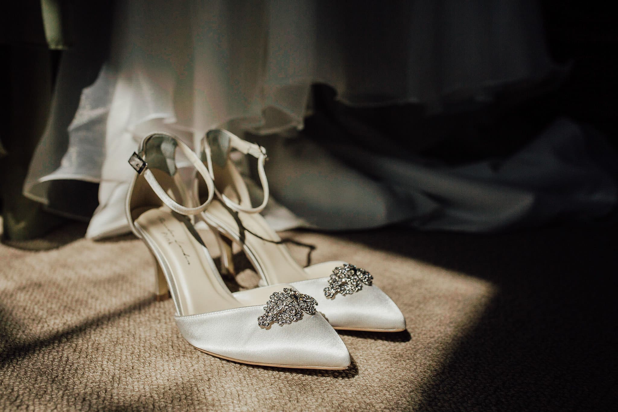 bride's ivory shoes with diamanté's buckle