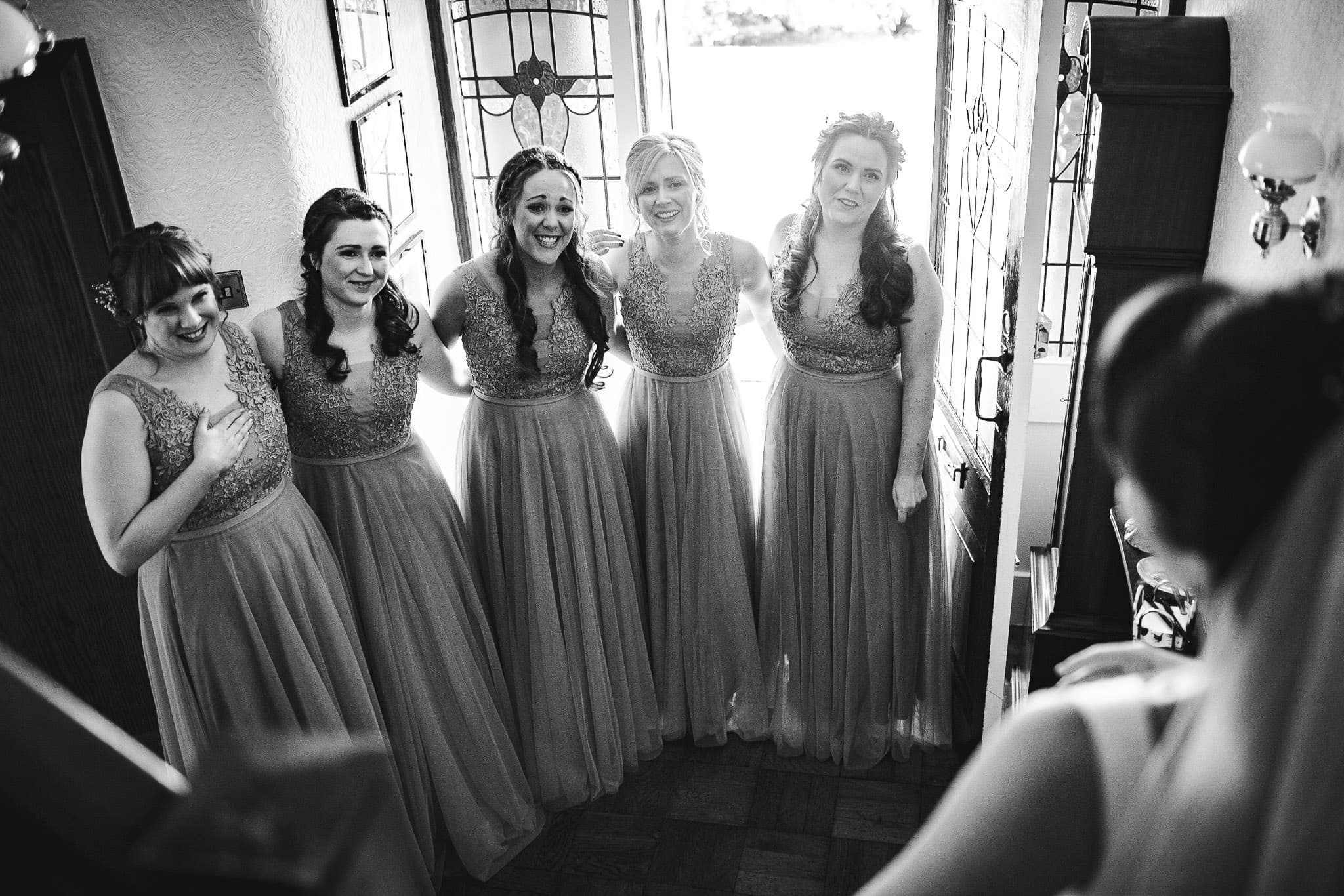 bridesmaids seeing bride's wedding dress for first time