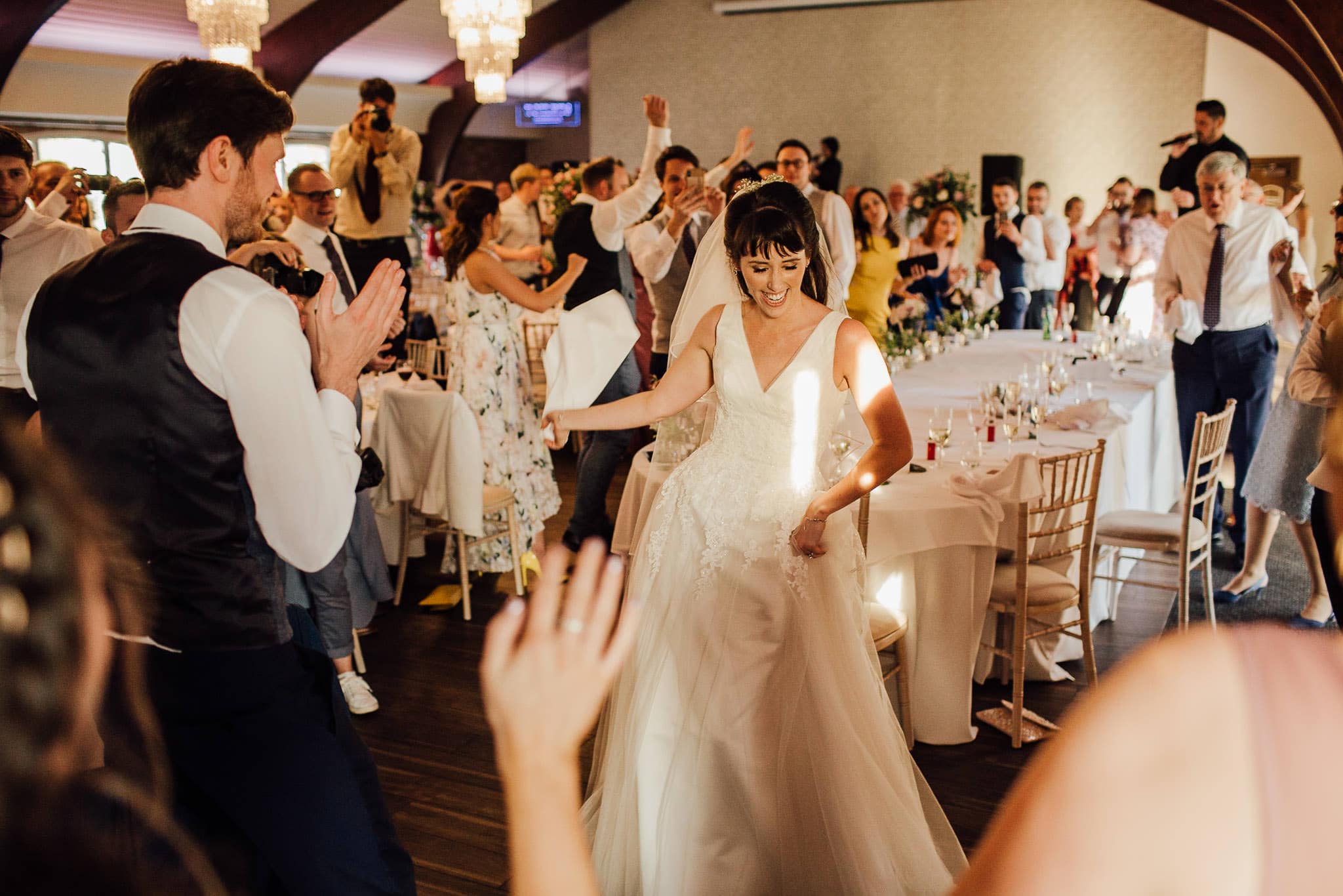 bride dancing to singing waiters at Colshaw Hall