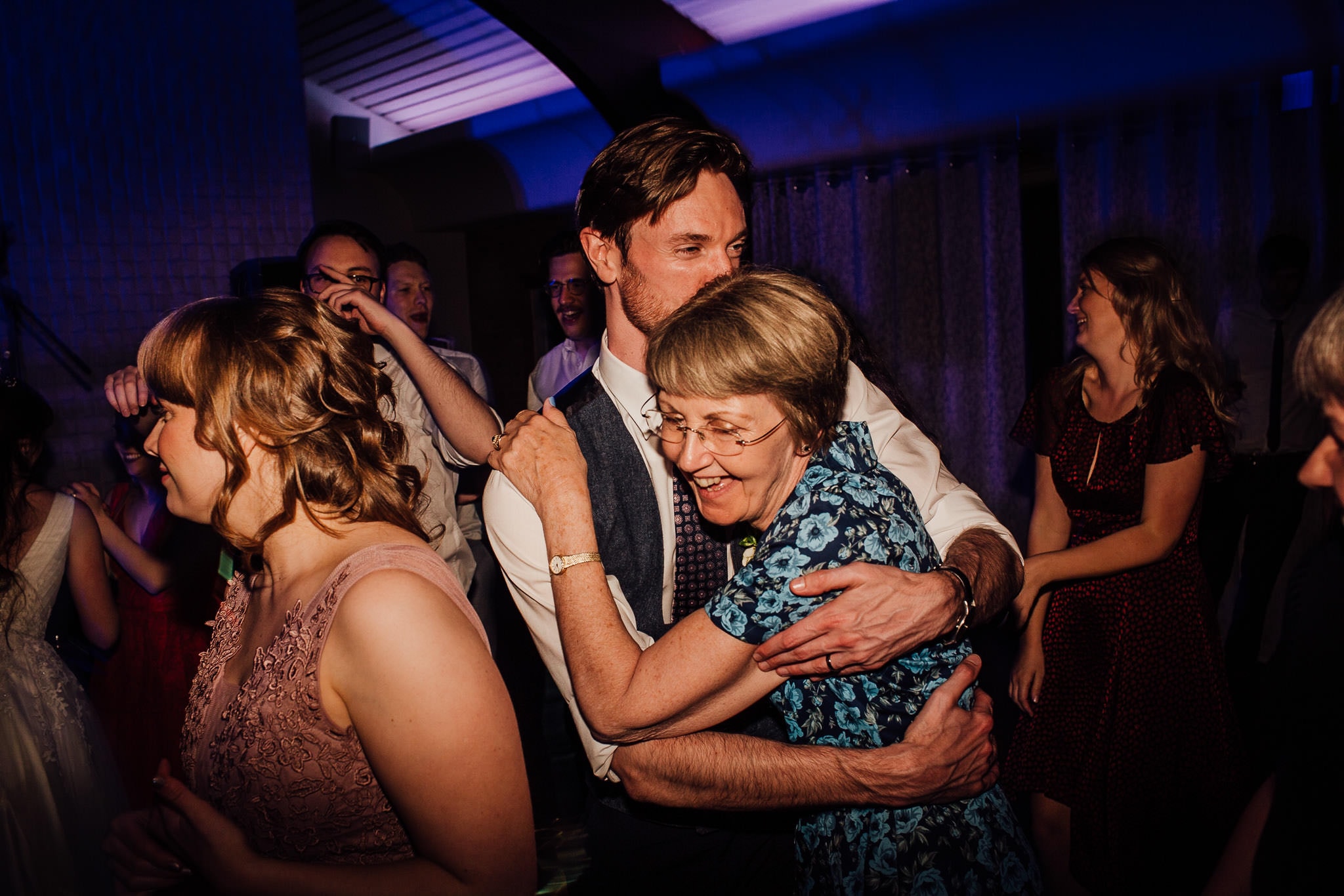 groom hugging his Mum